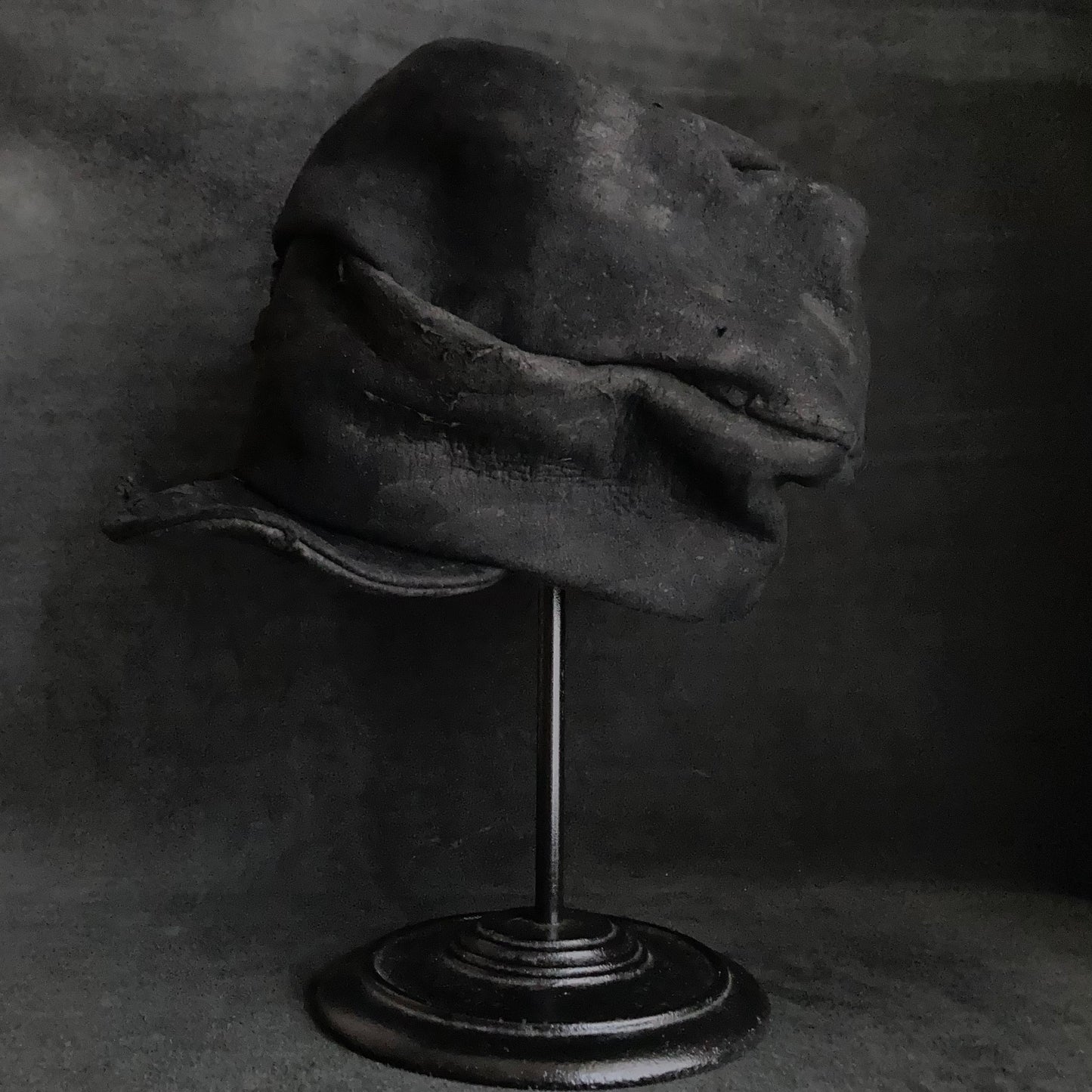Floor under black leather turn cap