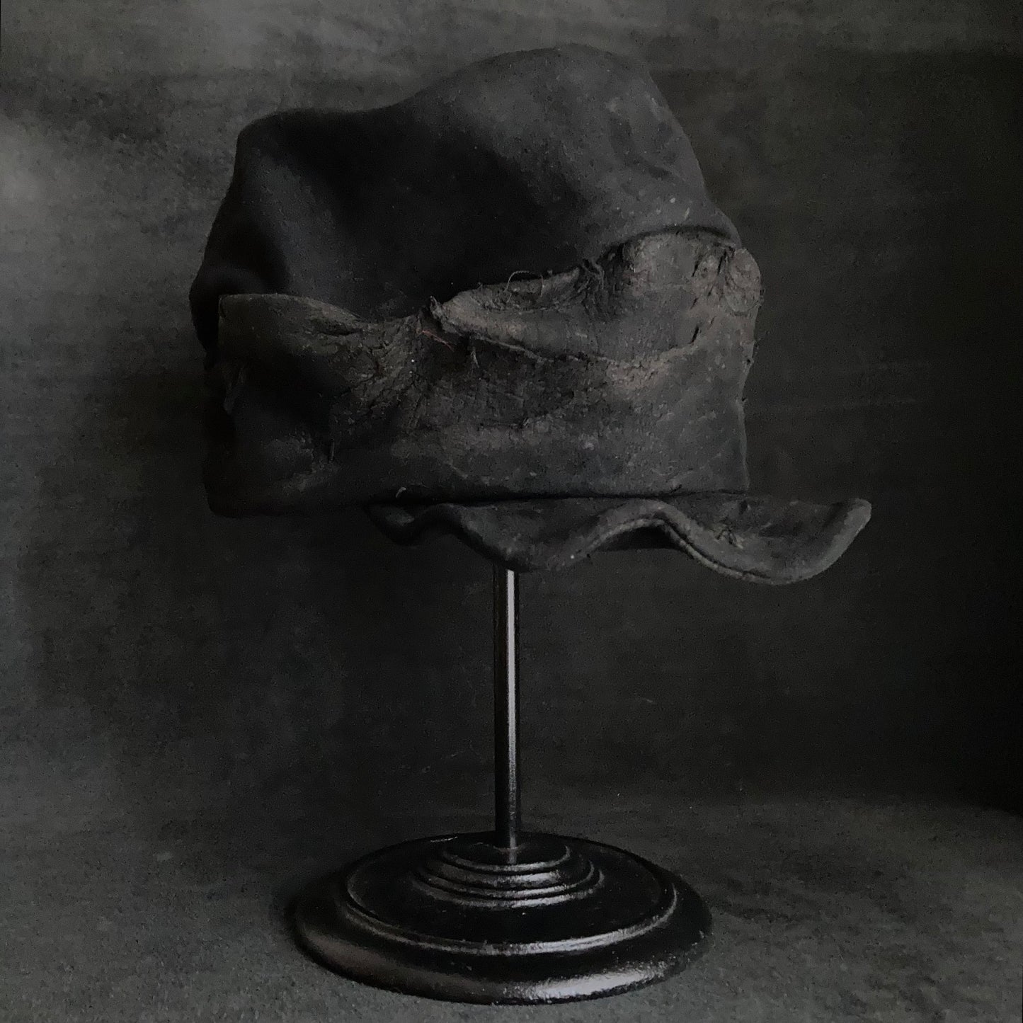 Floor under black leather turn cap