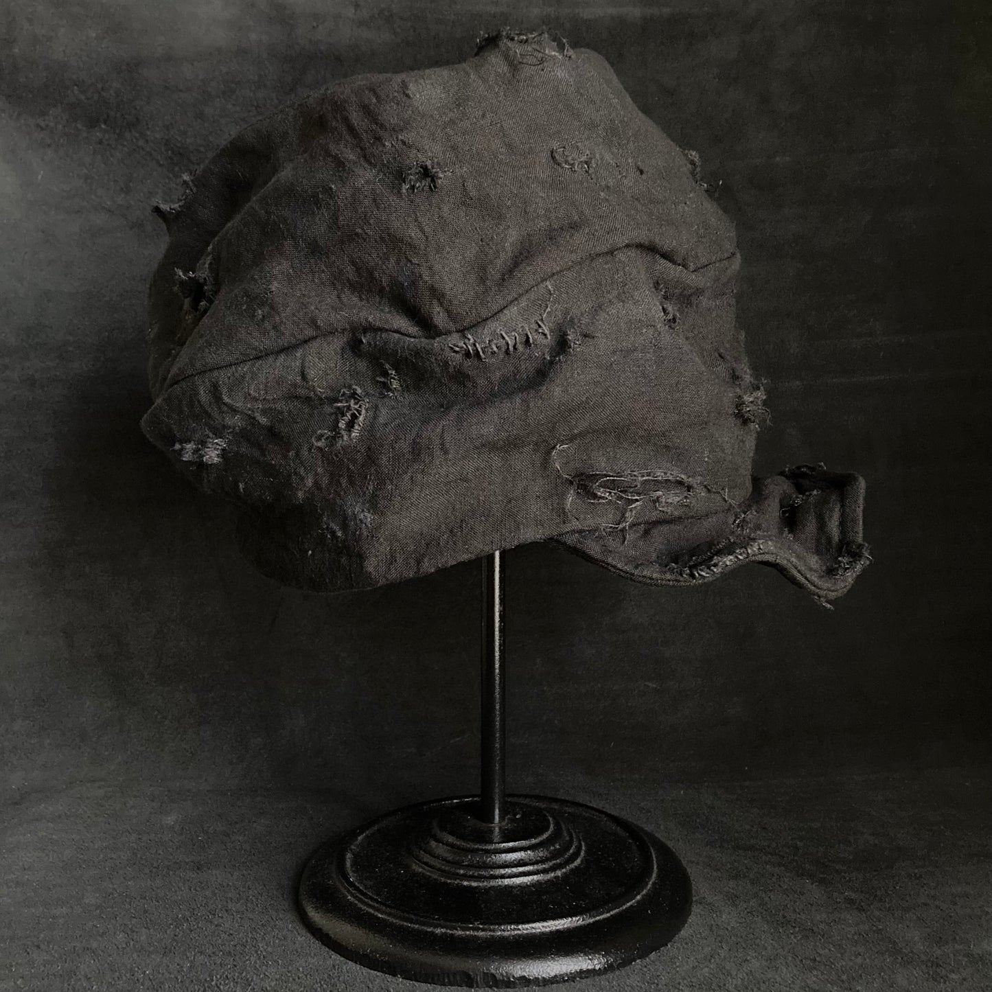 Thin black linen tattered turn cap