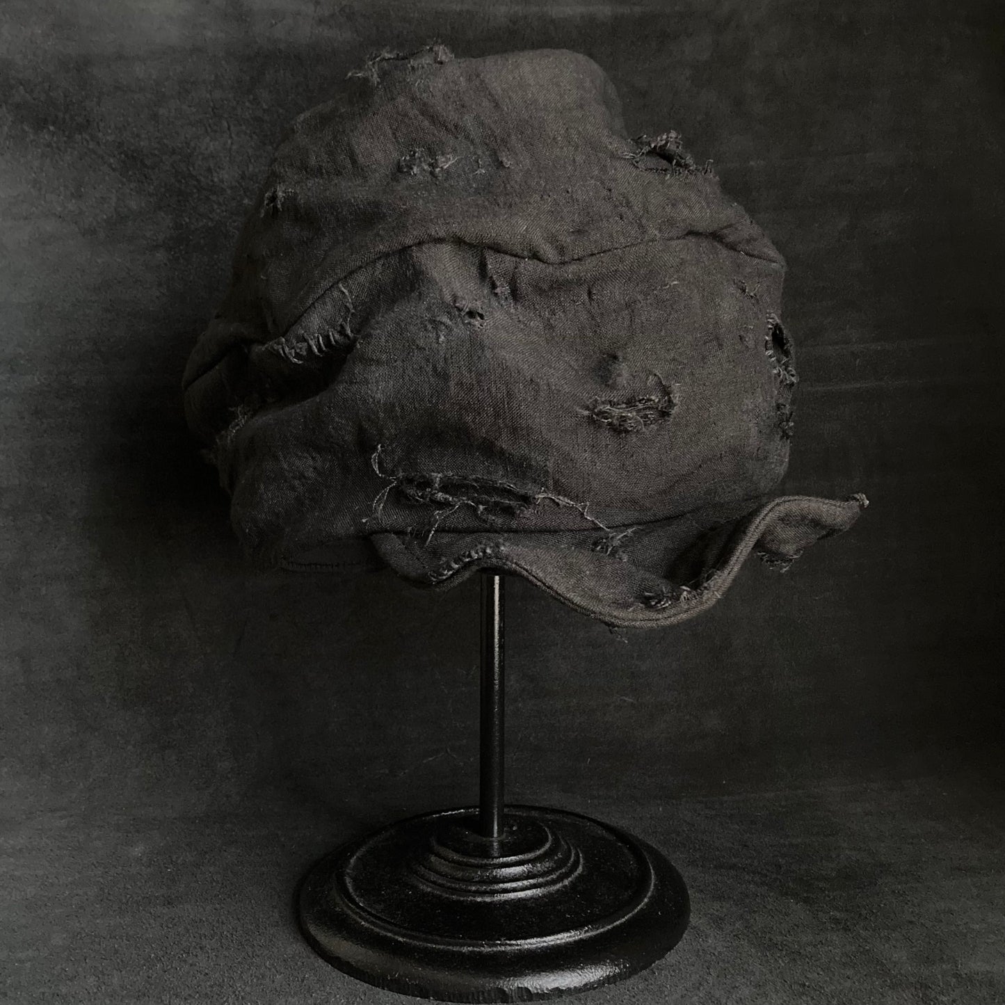Thin black linen tattered turn cap