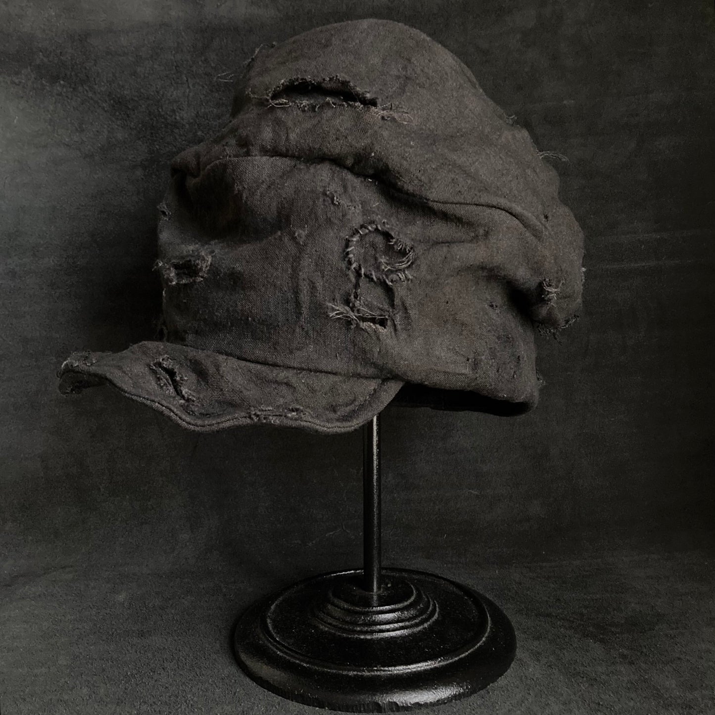 Thin black linen tattered turn cap