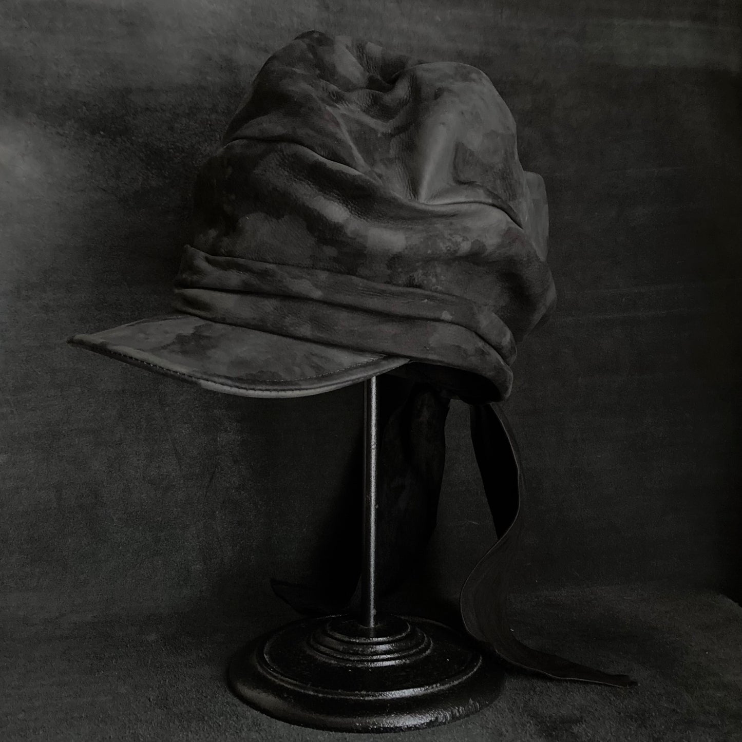 Bleaching black leather martial turn cap