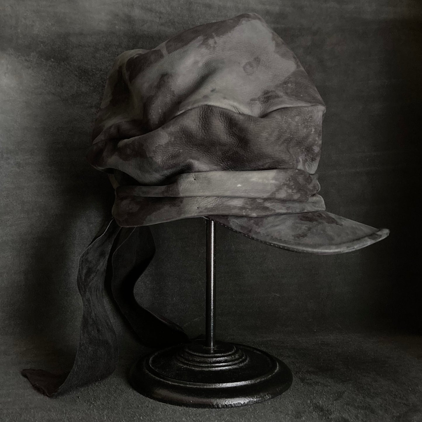 Bleaching black leather martial turn cap