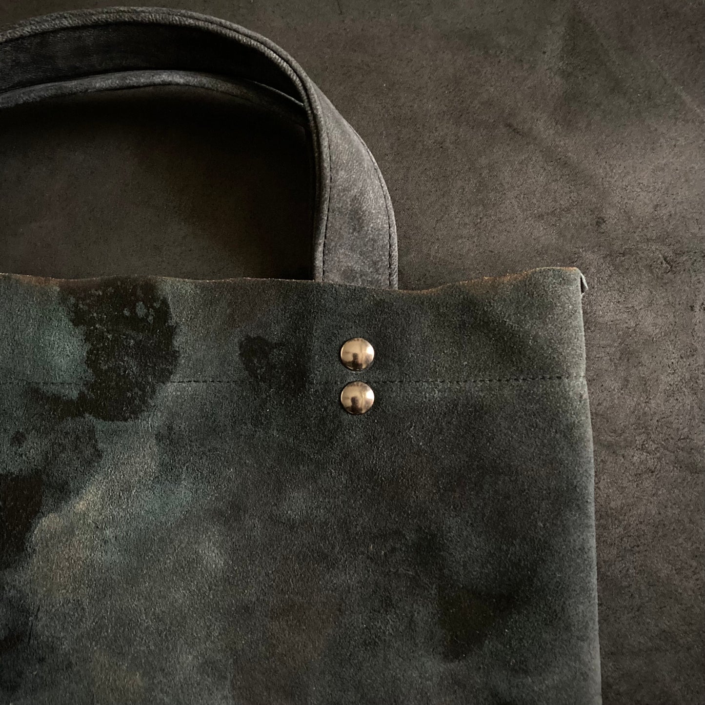 Bleached pale blue black leather tote bag