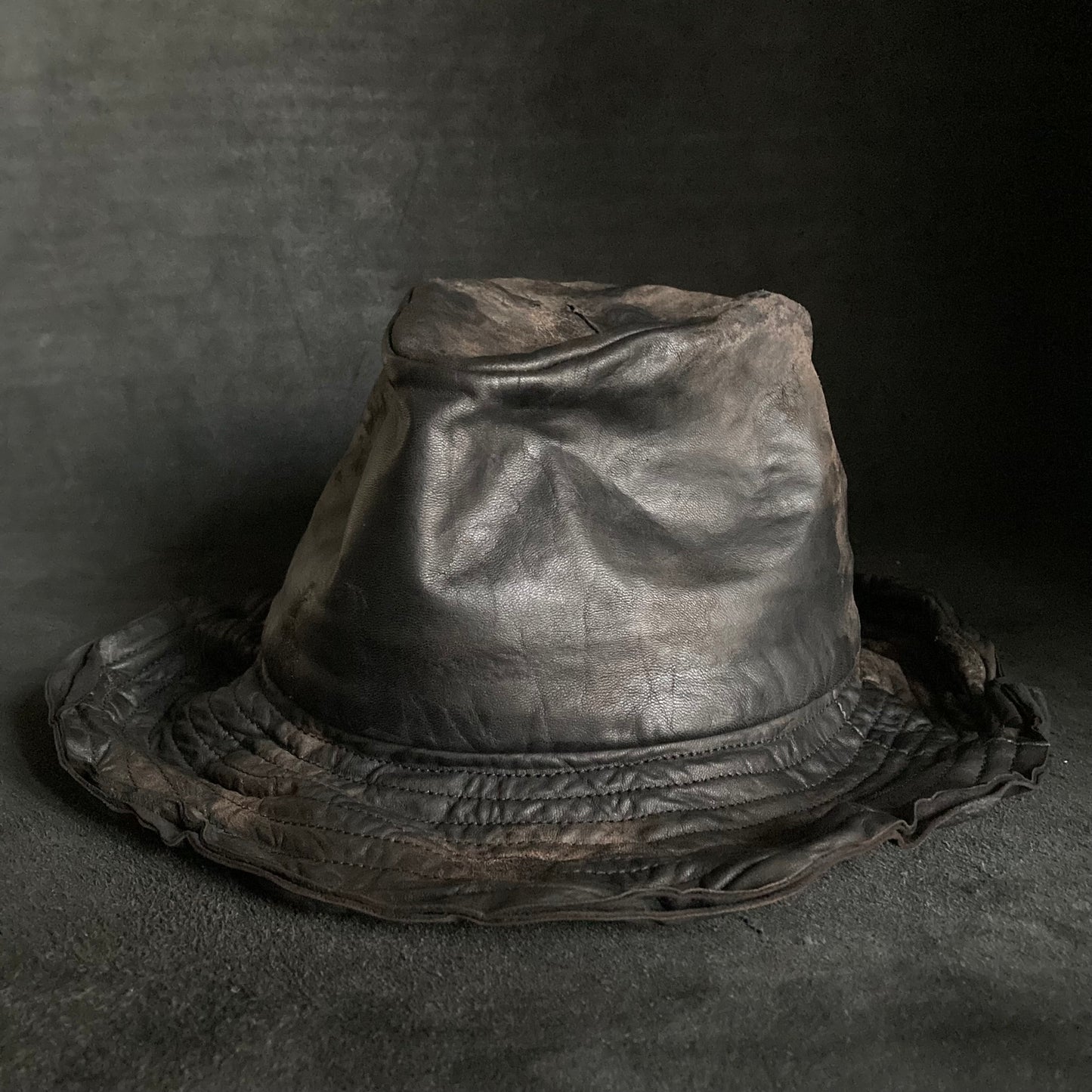 Cracked black leather fedora hat
