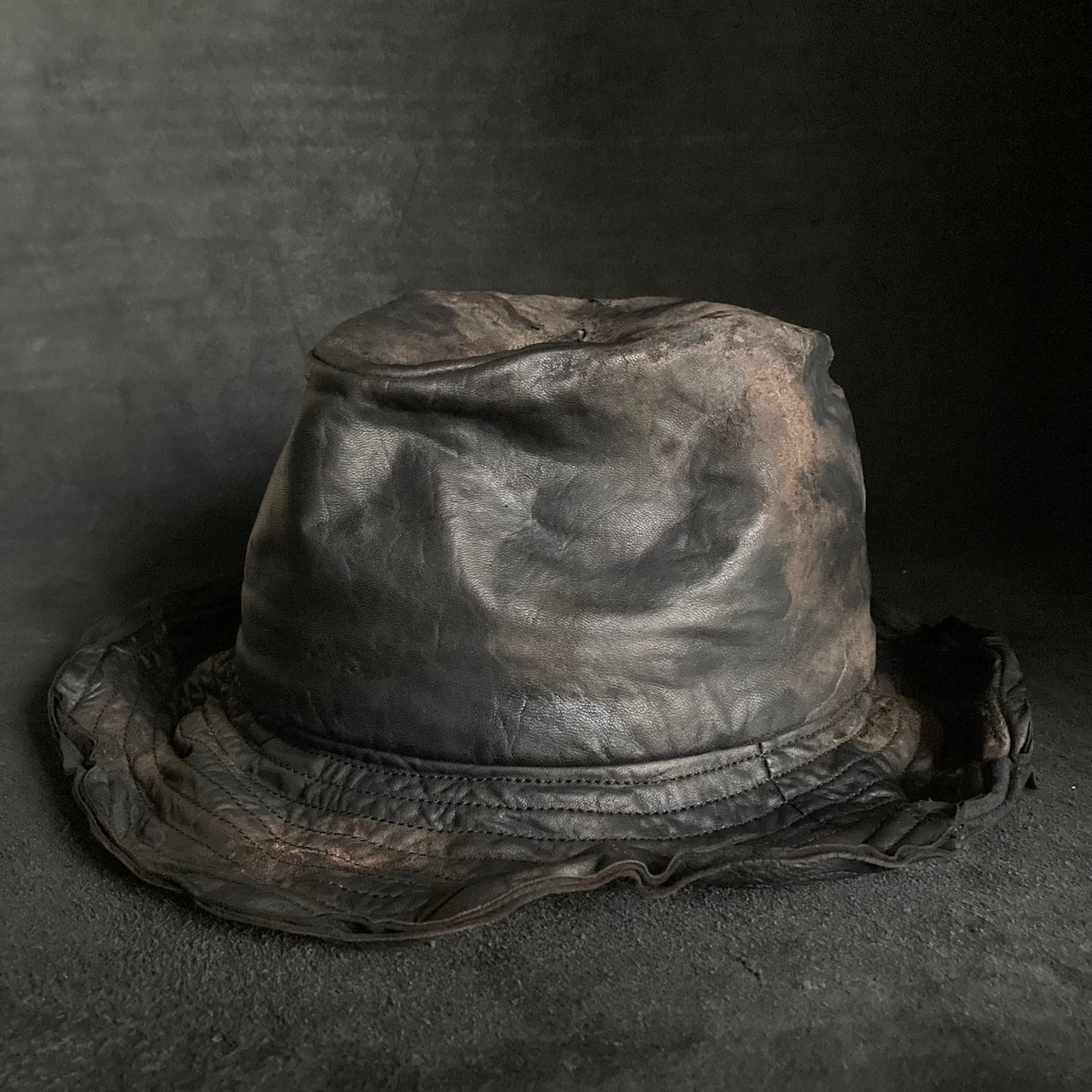 Cracked black leather fedora hat