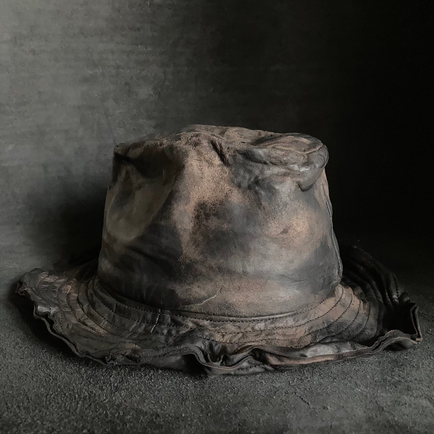 Cracked black leather fedora hat