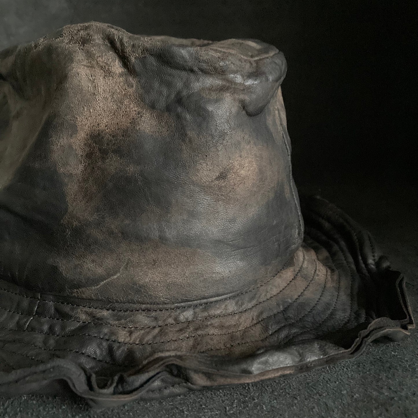 Cracked black leather fedora hat