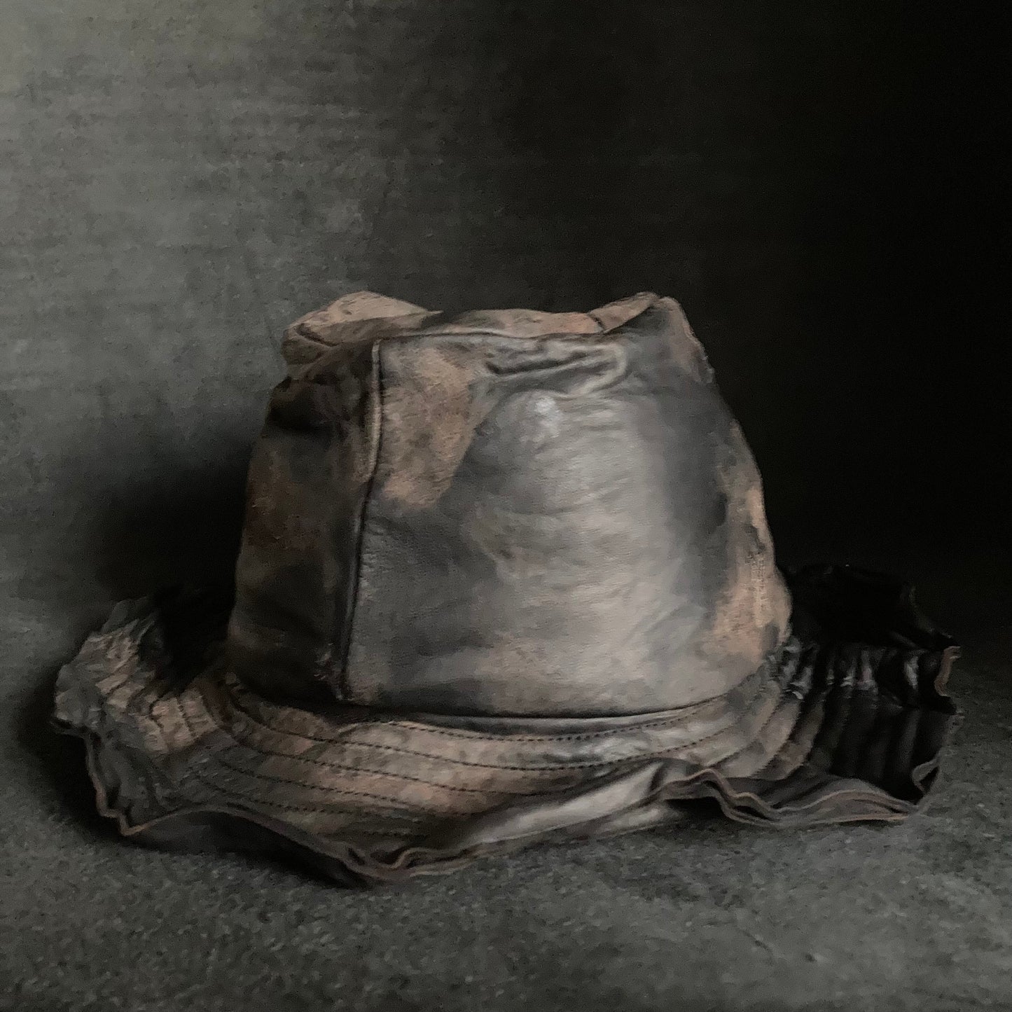 Cracked black leather fedora hat