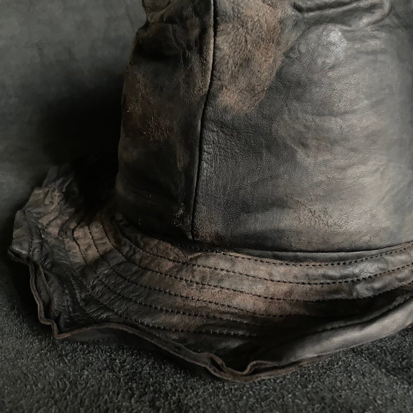 Cracked black leather fedora hat