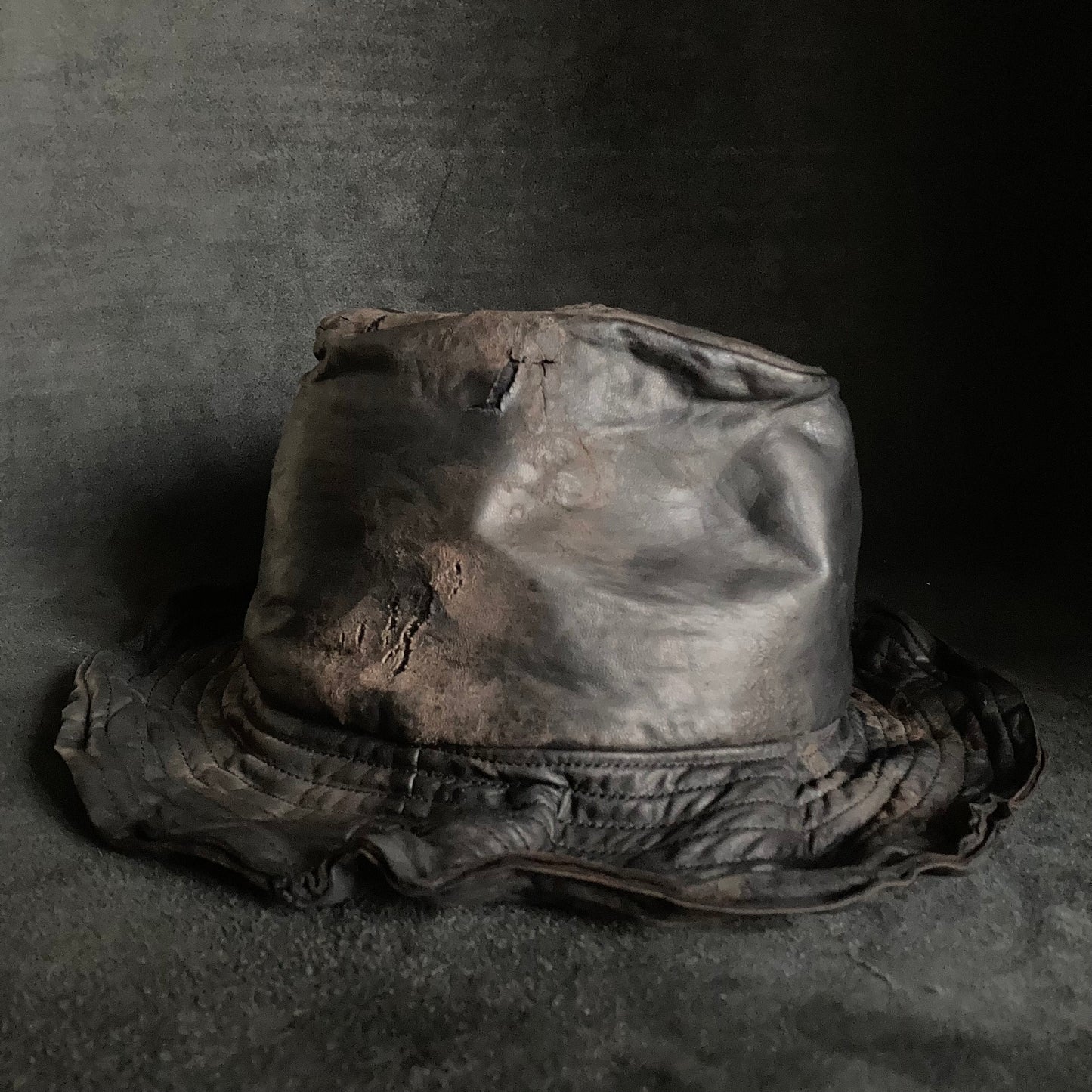 Cracked black leather fedora hat