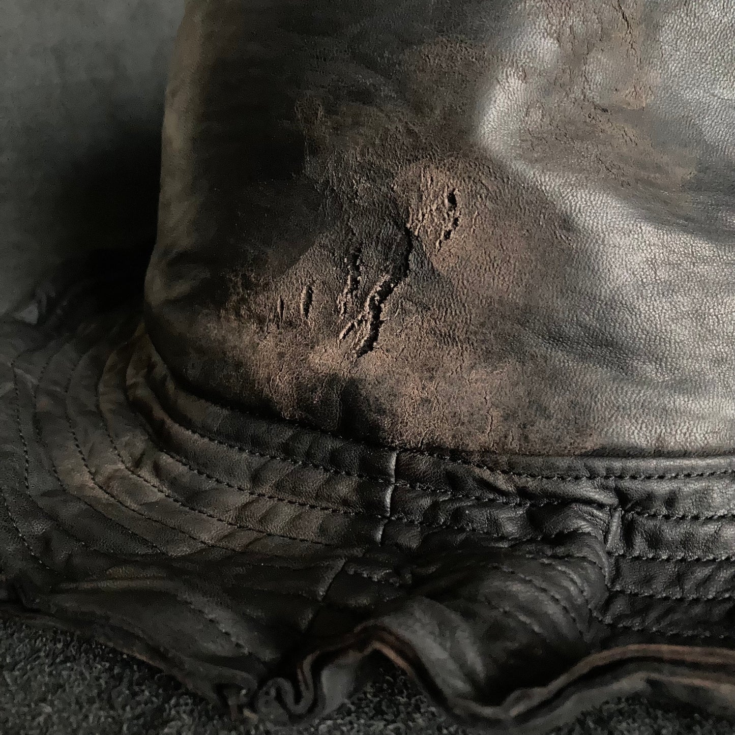 Cracked black leather fedora hat