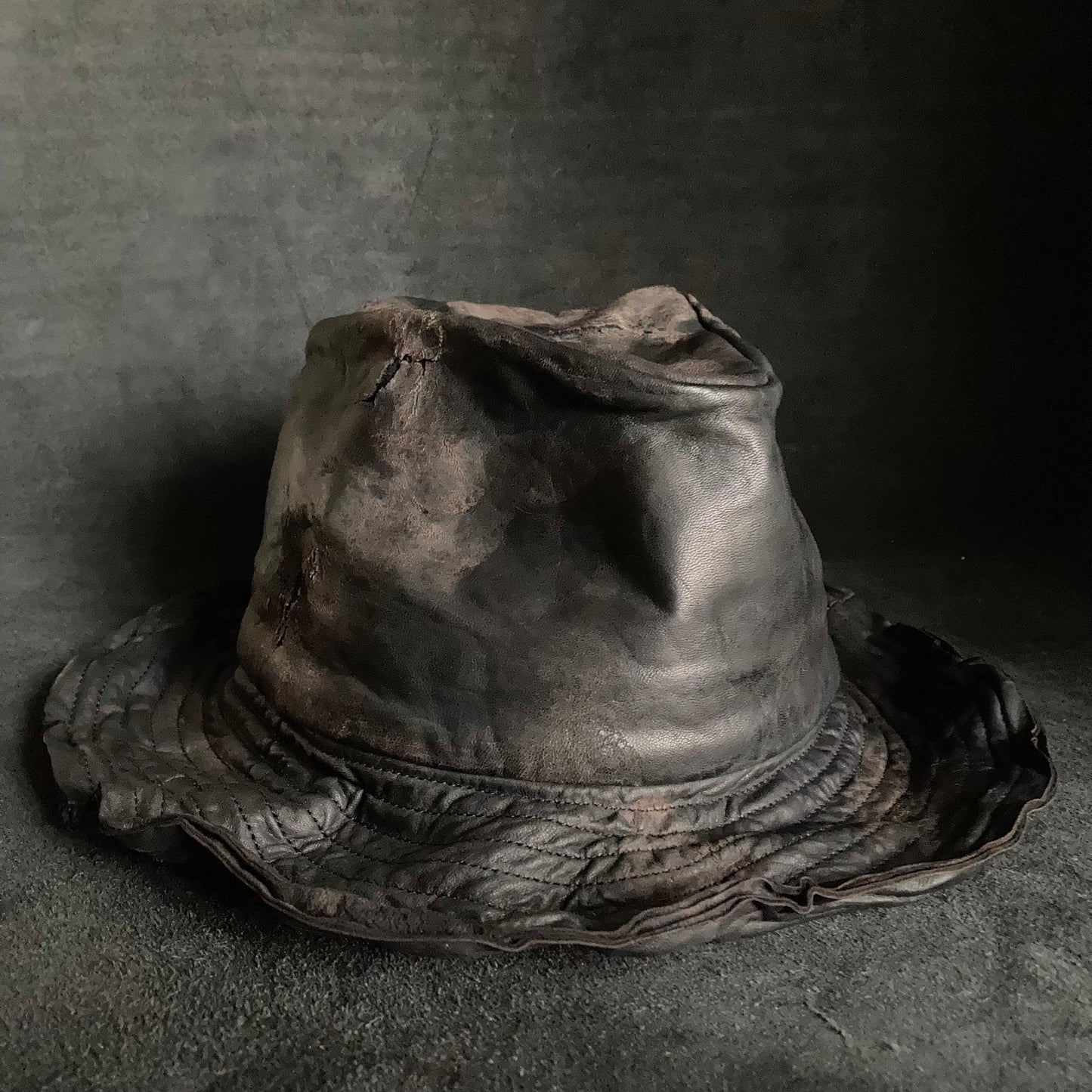 Cracked black leather fedora hat