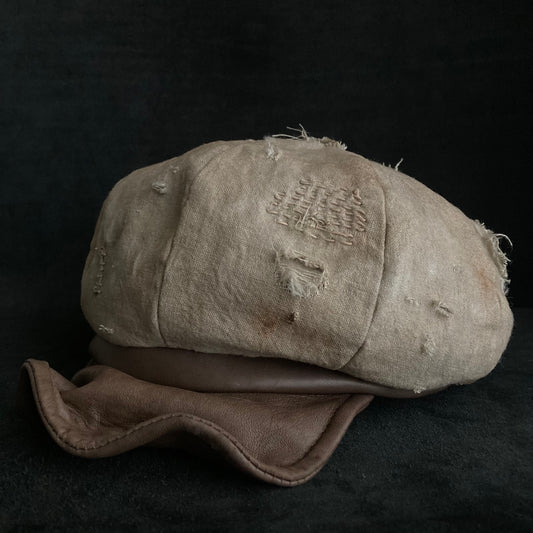 Sand tatters damage linen casquette