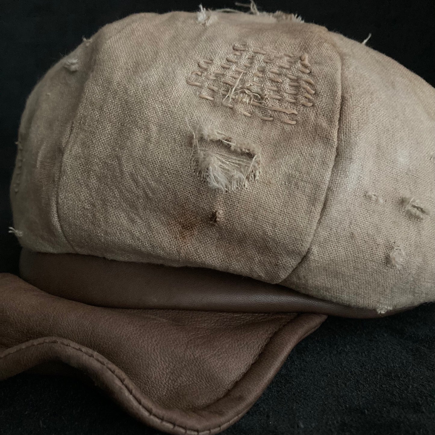 Sand tatters damage linen casquette