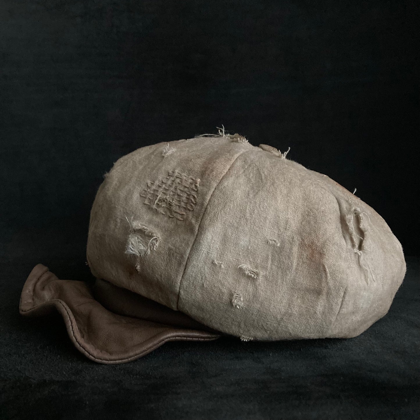 Sand tatters damage linen casquette