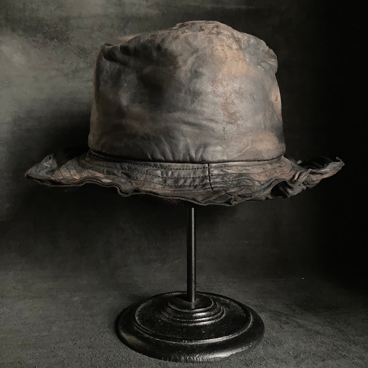 Cracked black leather fedora hat