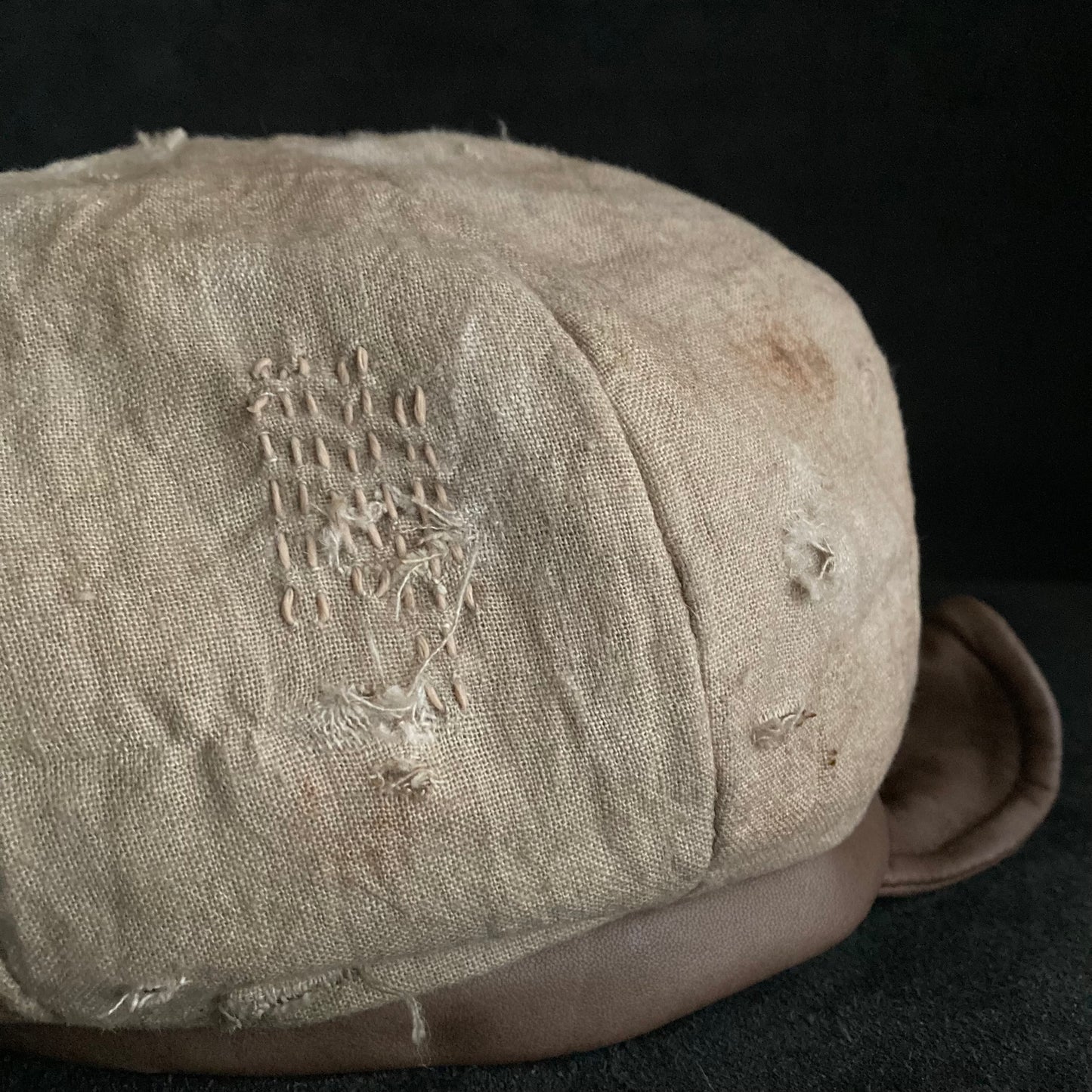 Sand tatters damage linen casquette