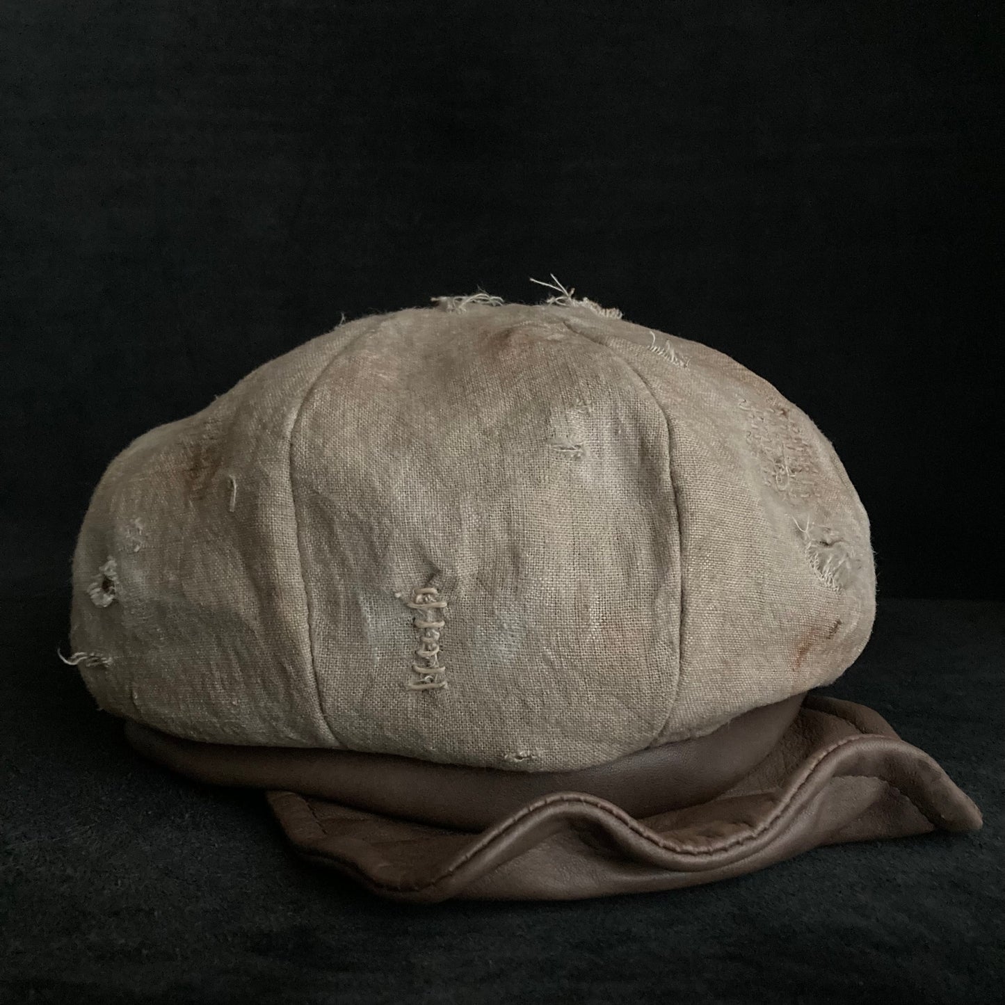 Sand tatters damage linen casquette
