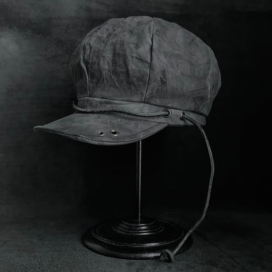 Uneven dark seabed leather cap