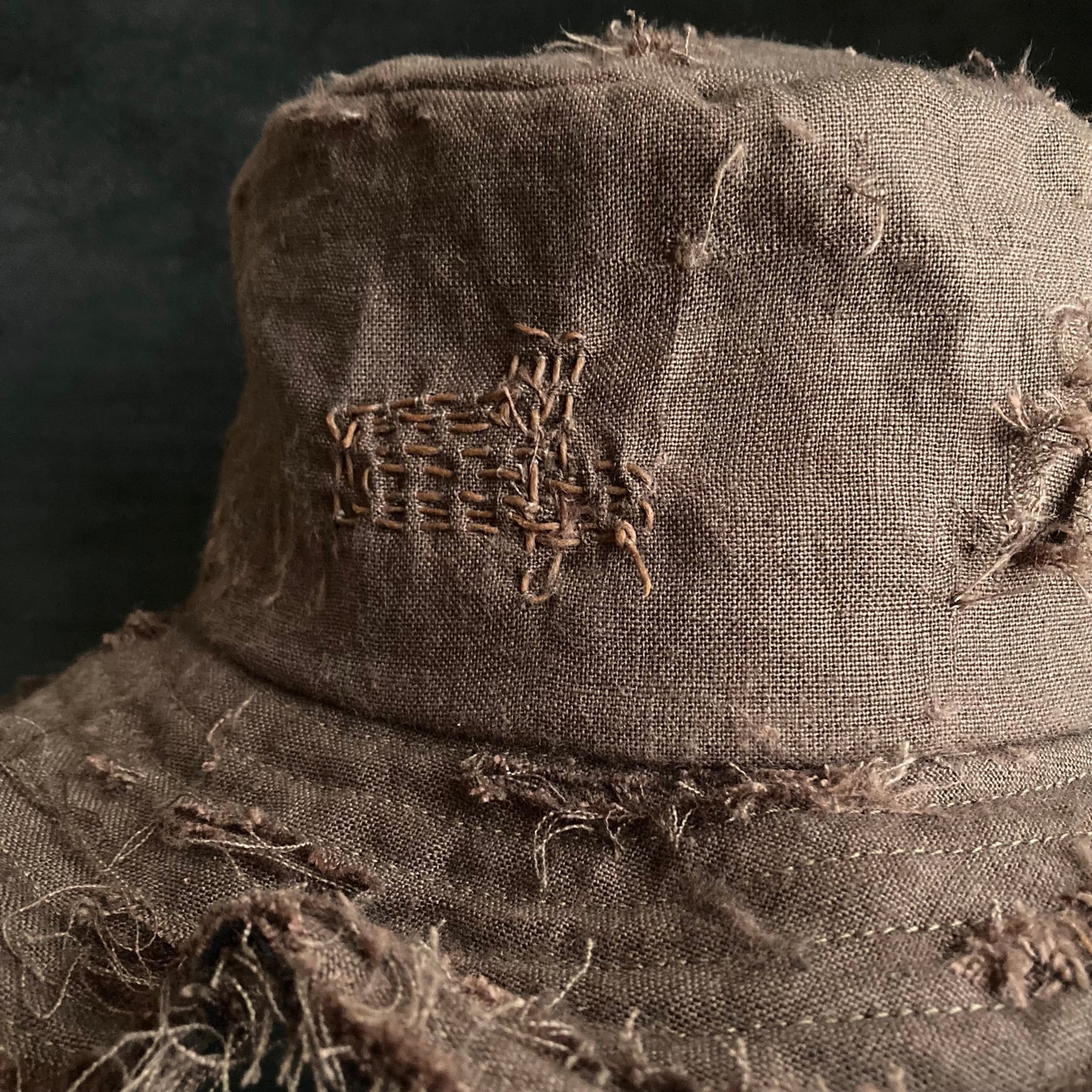 Brown linen damage stitch bucket hat