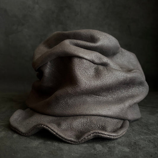 Graphite black leather turn cap