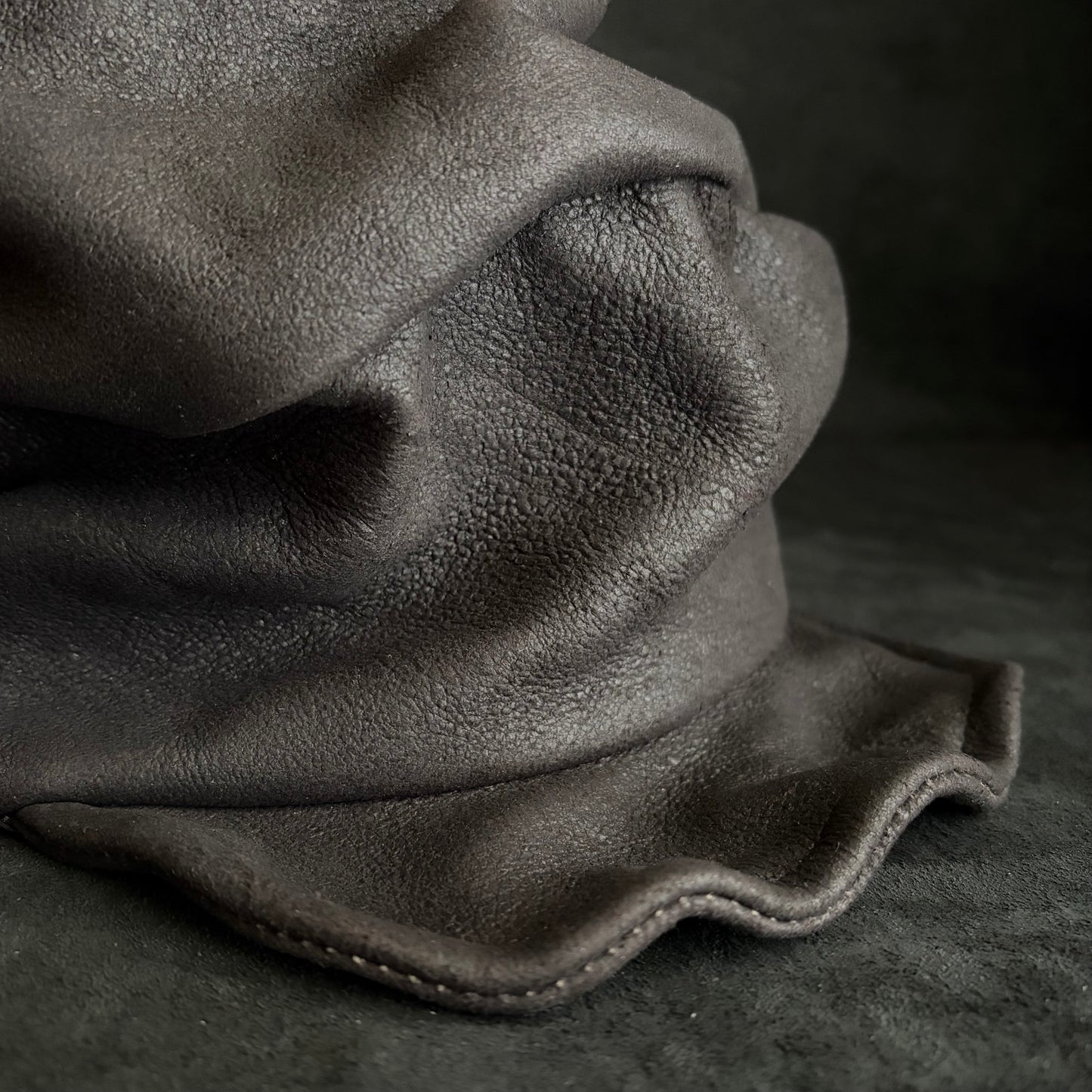 Graphite black leather turn cap