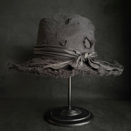 Black linen damage around fedora hat