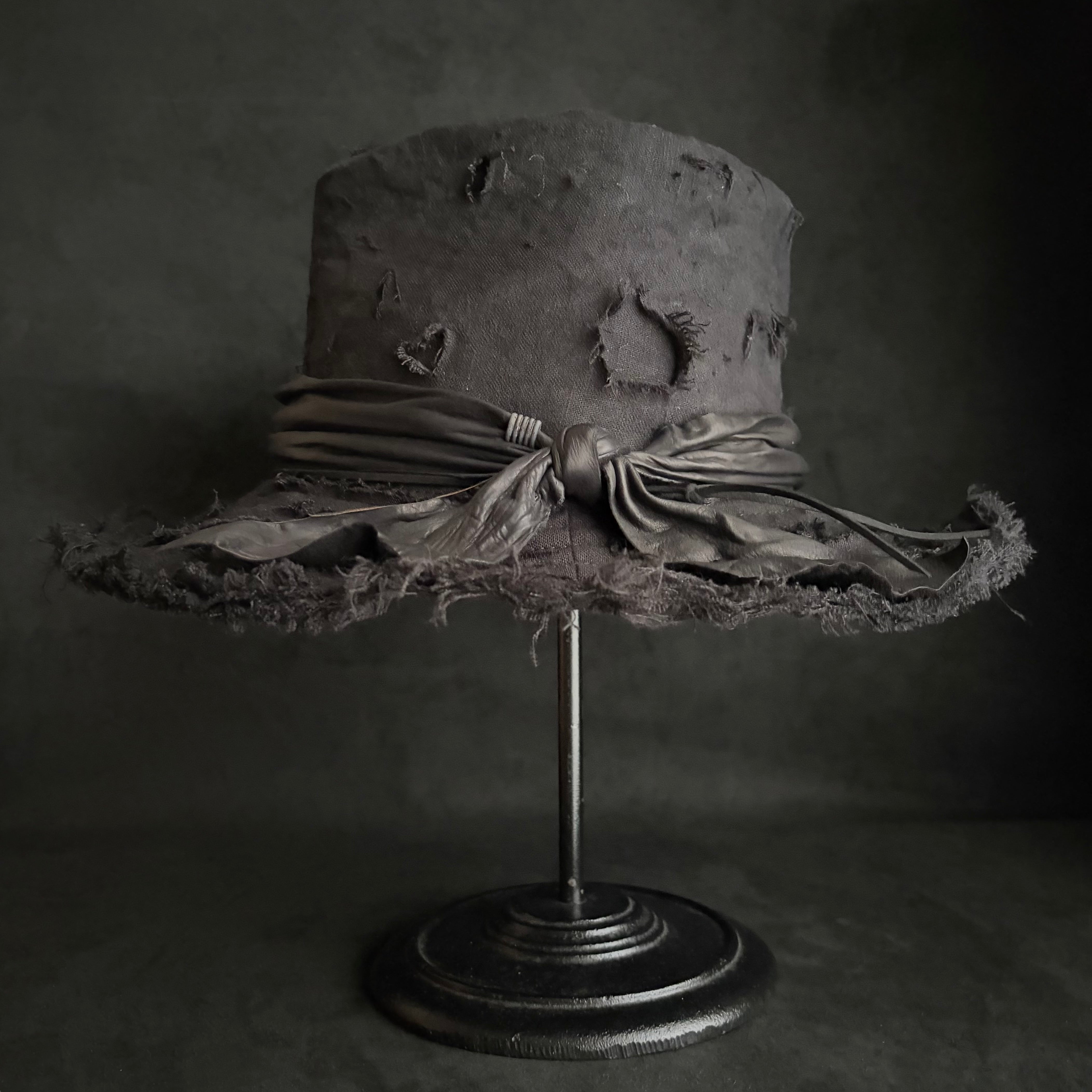 Black linen damage around fedora hat – triangles hat