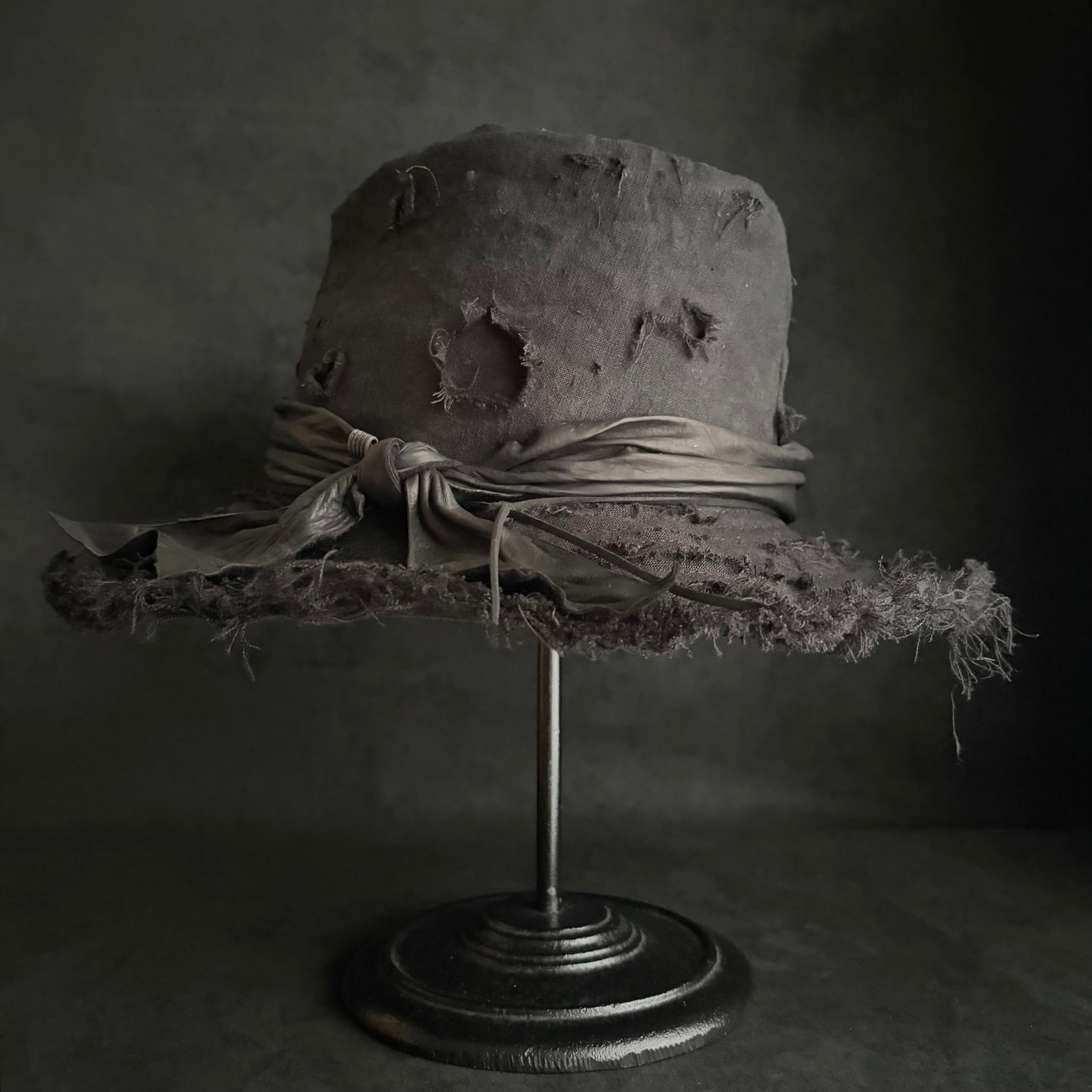 Black linen damage around fedora hat – triangles hat