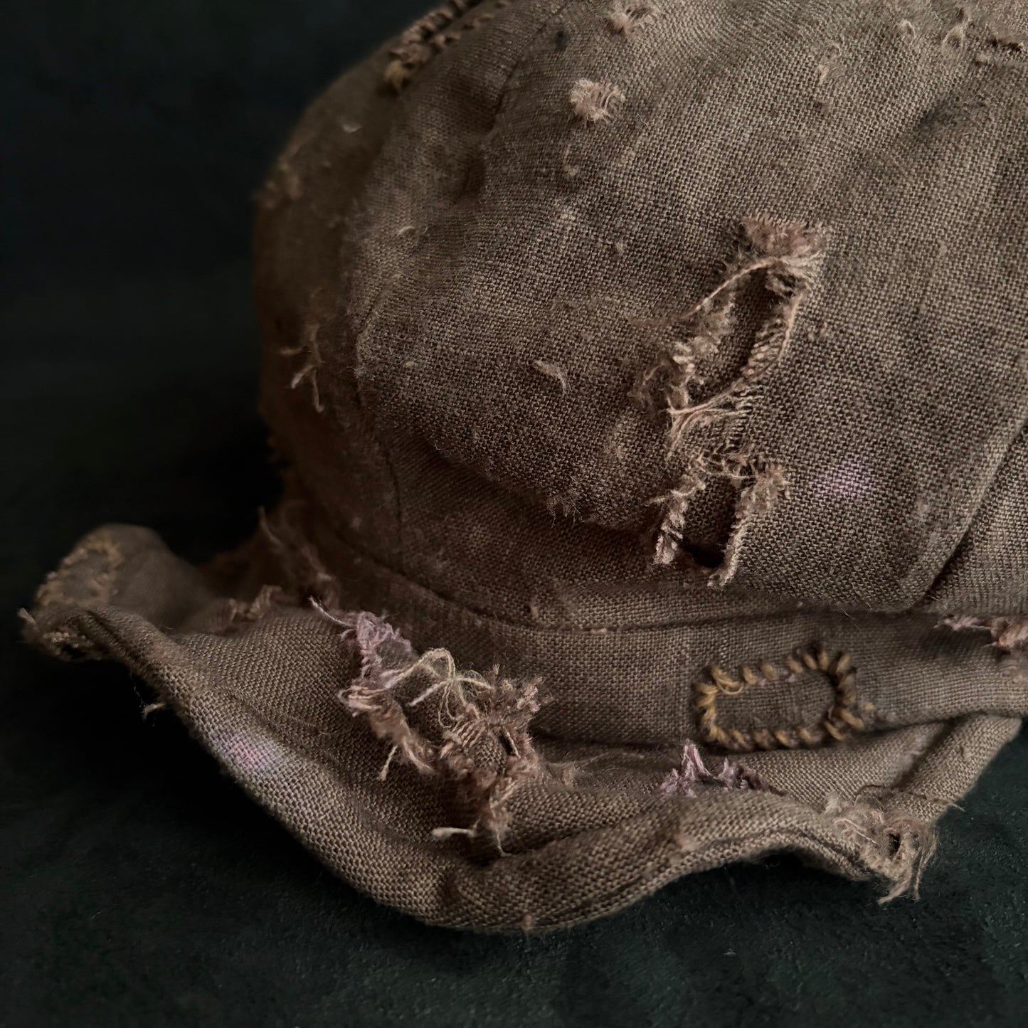 Brown linen damaged discolored casquette