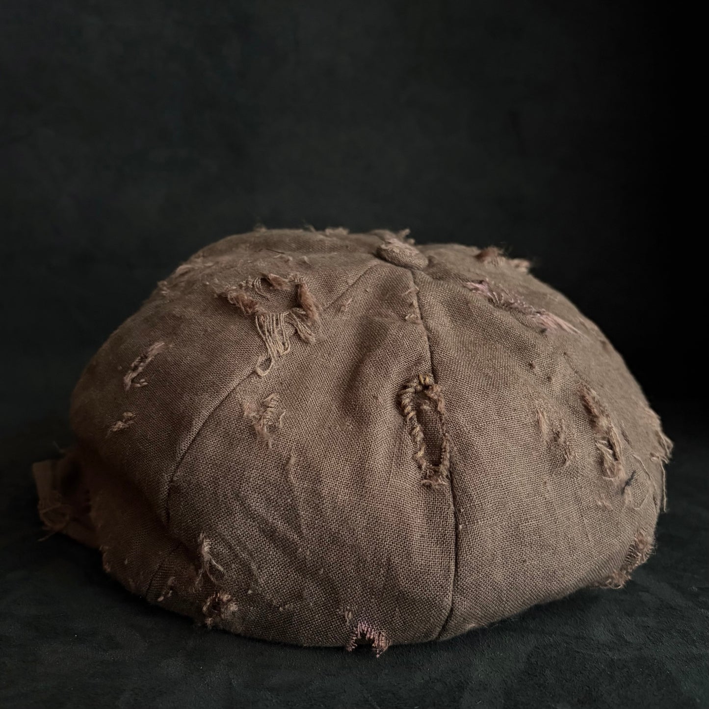 Brown linen damaged discolored casquette