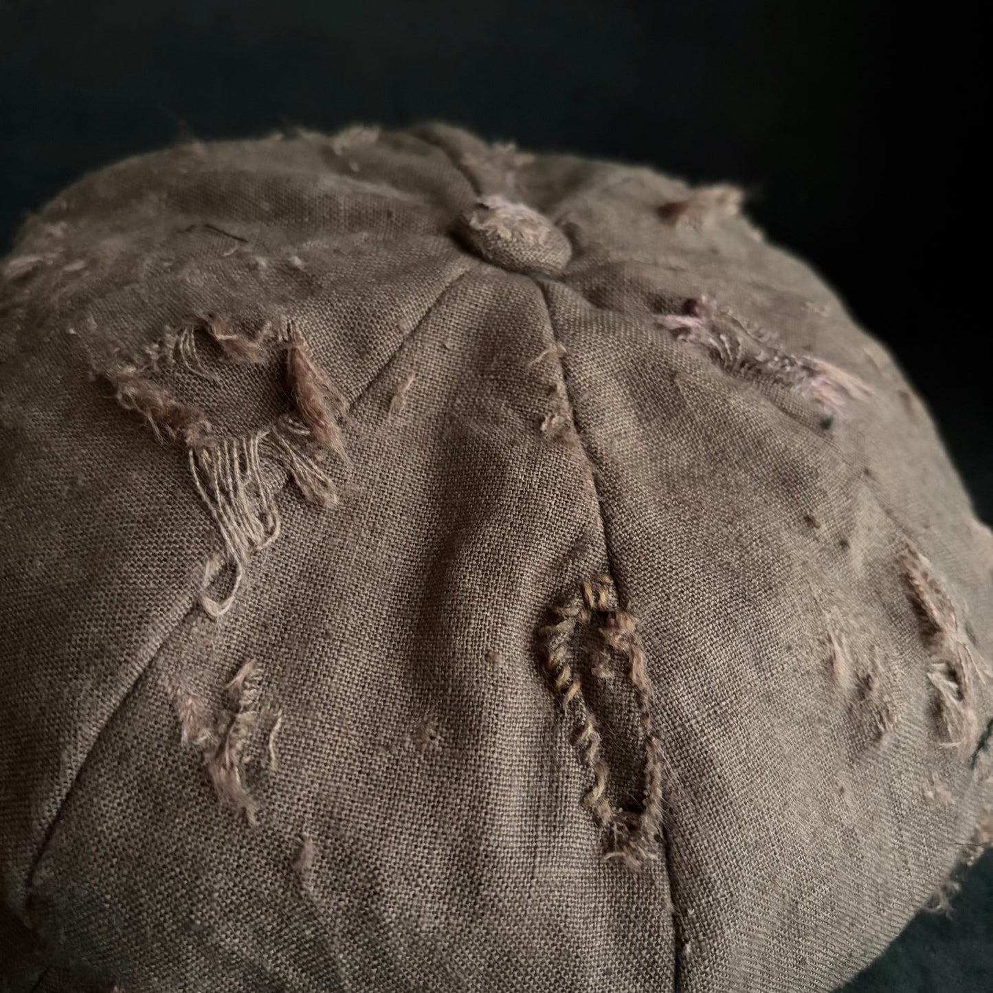 Brown linen damaged discolored casquette