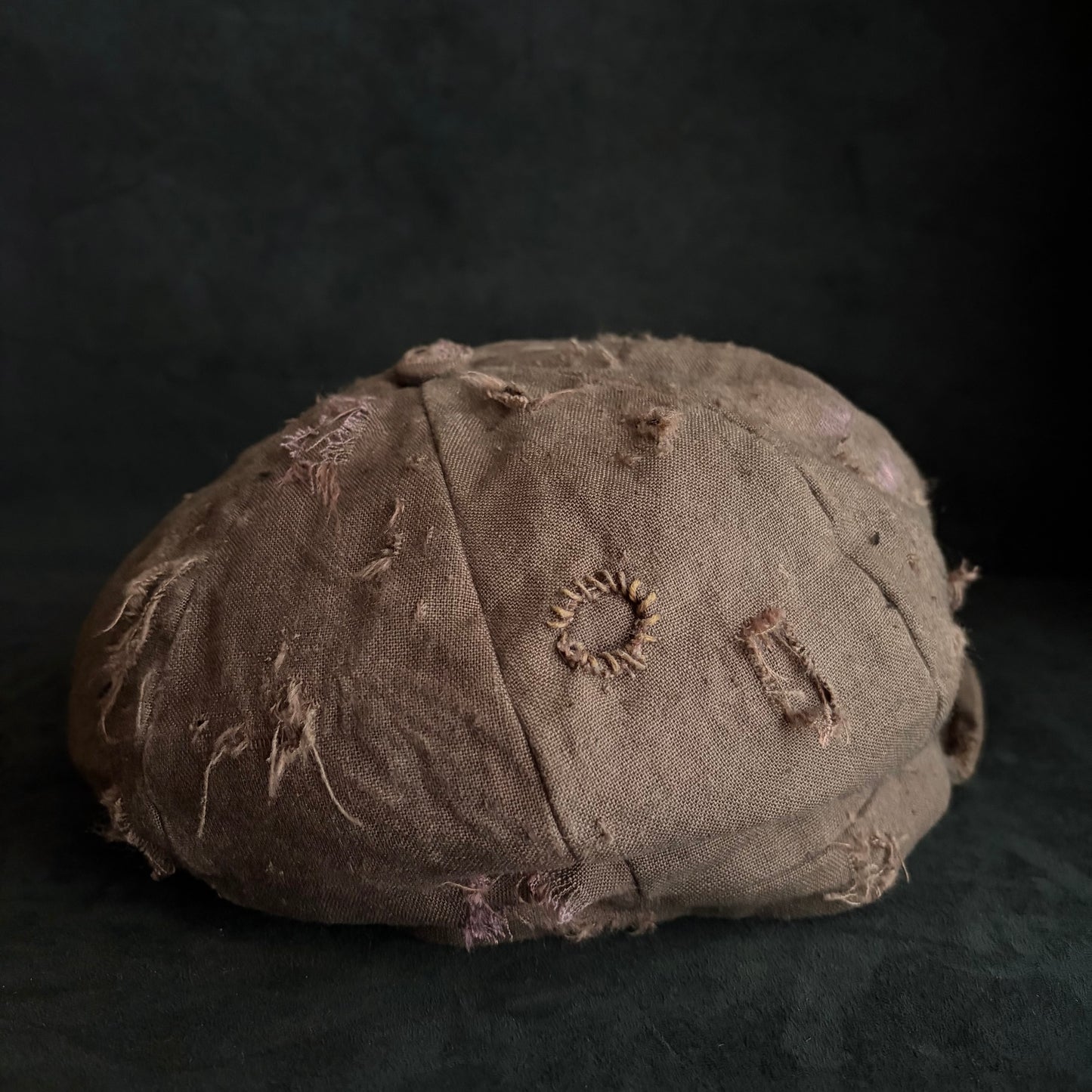 Brown linen damaged discolored casquette