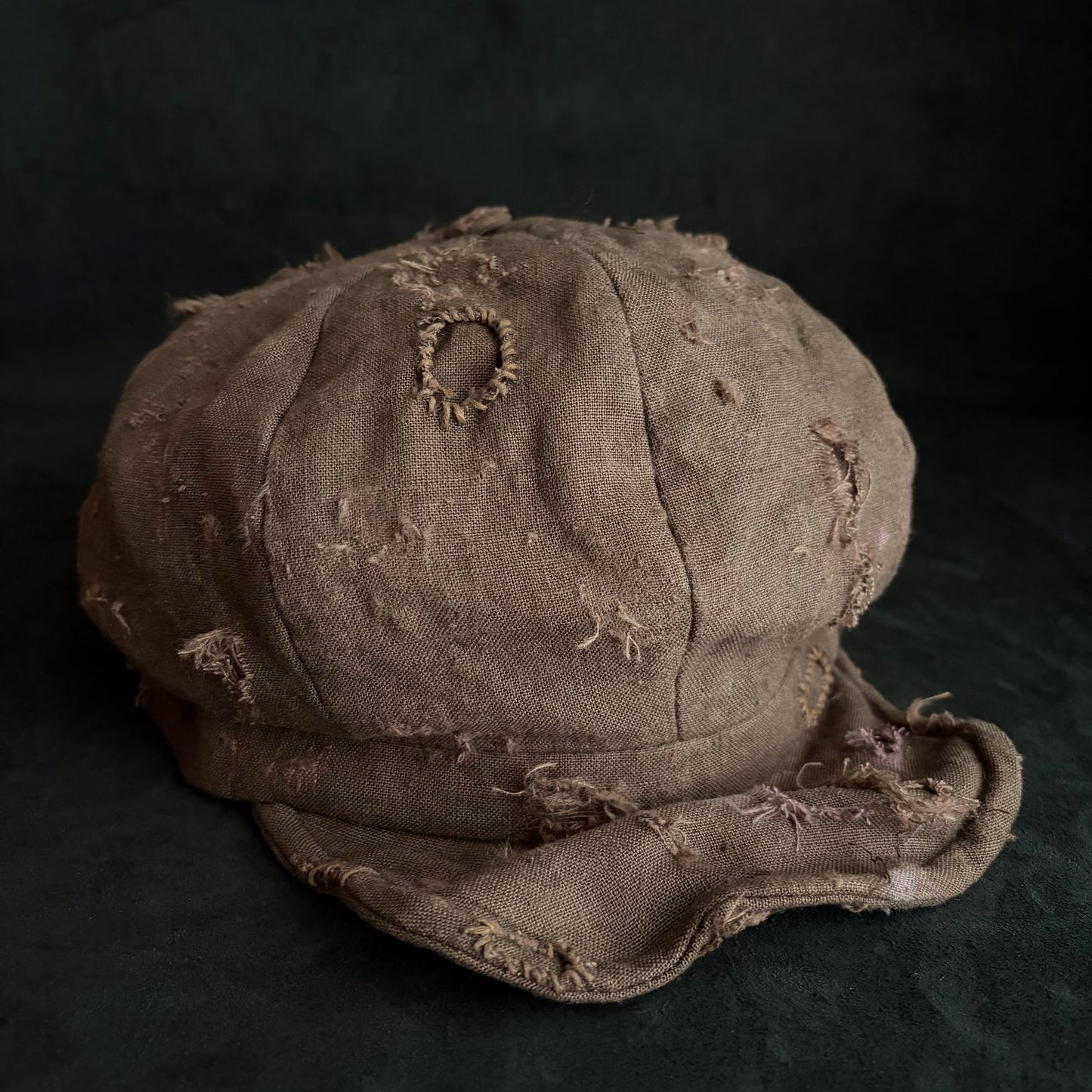 Brown linen damaged discolored casquette