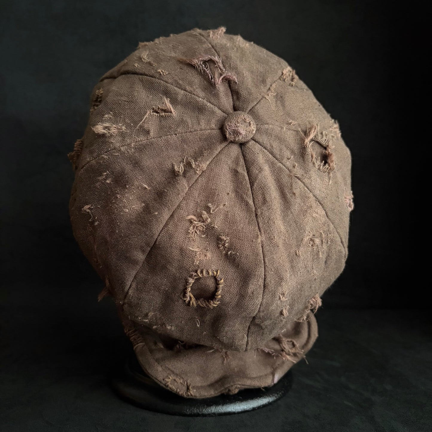 Brown linen damaged discolored casquette