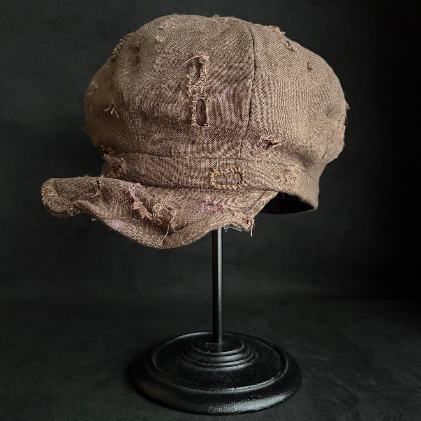 Brown linen damaged discolored casquette