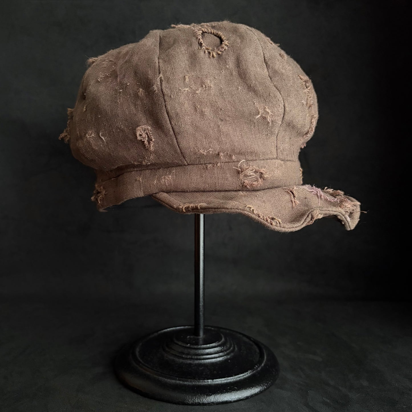 Brown linen damaged discolored casquette