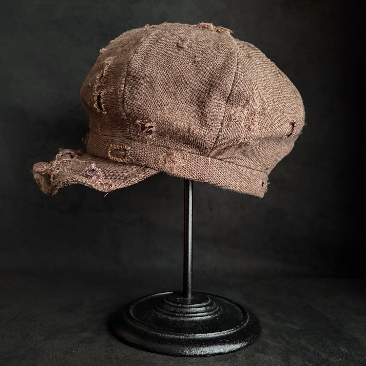 Brown linen damaged discolored casquette