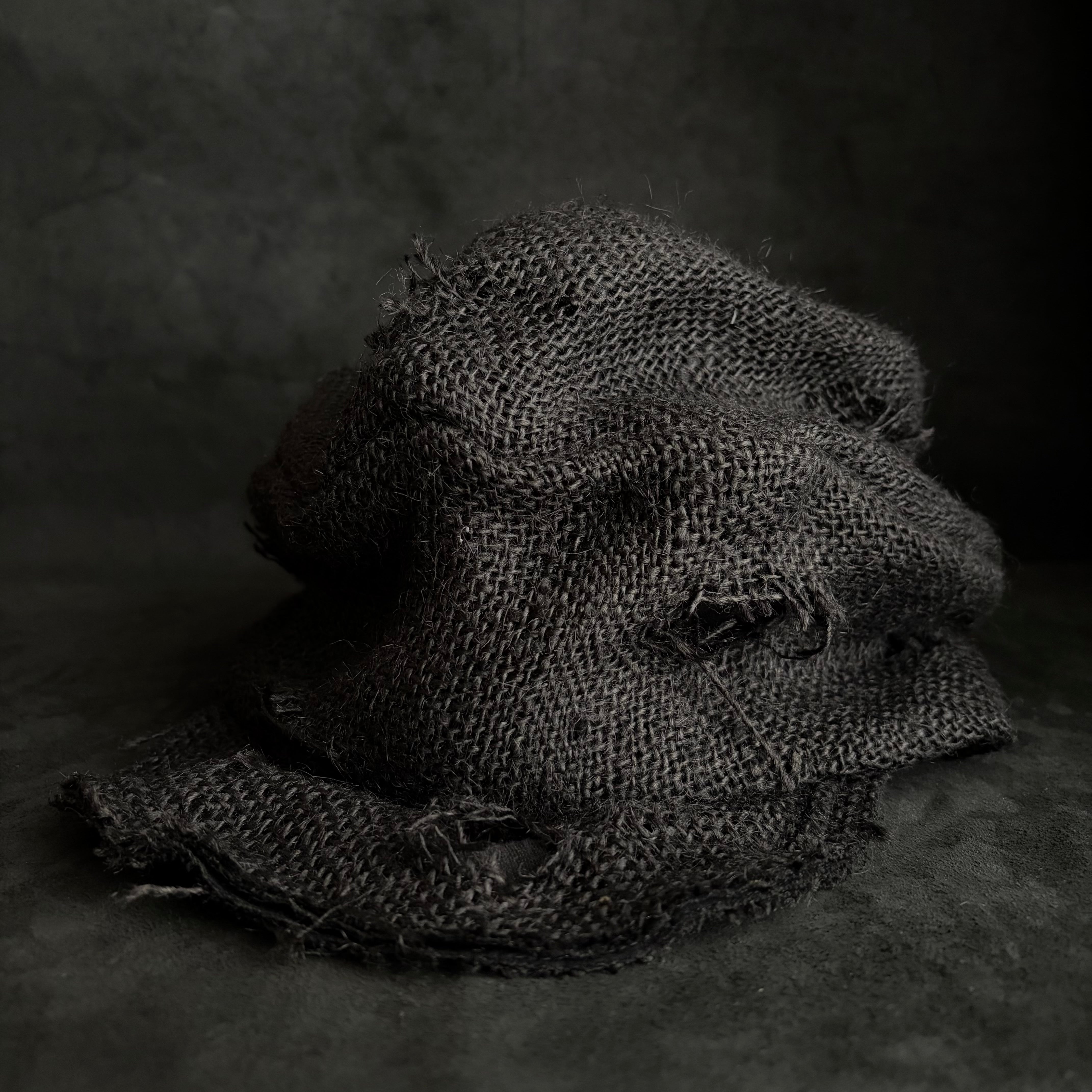 Black jute damage turn cap – triangles hat