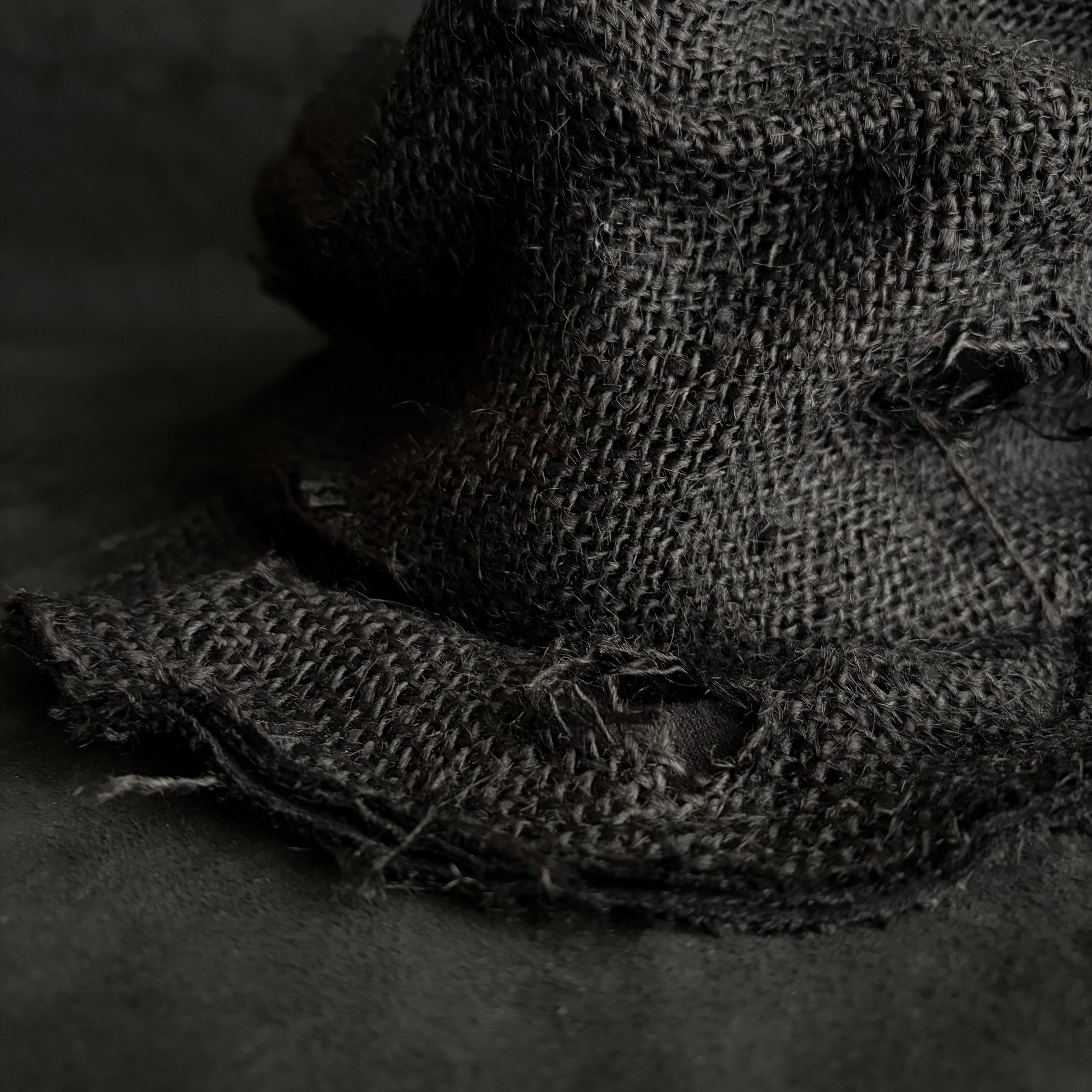 Black jute damage turn cap – triangles hat