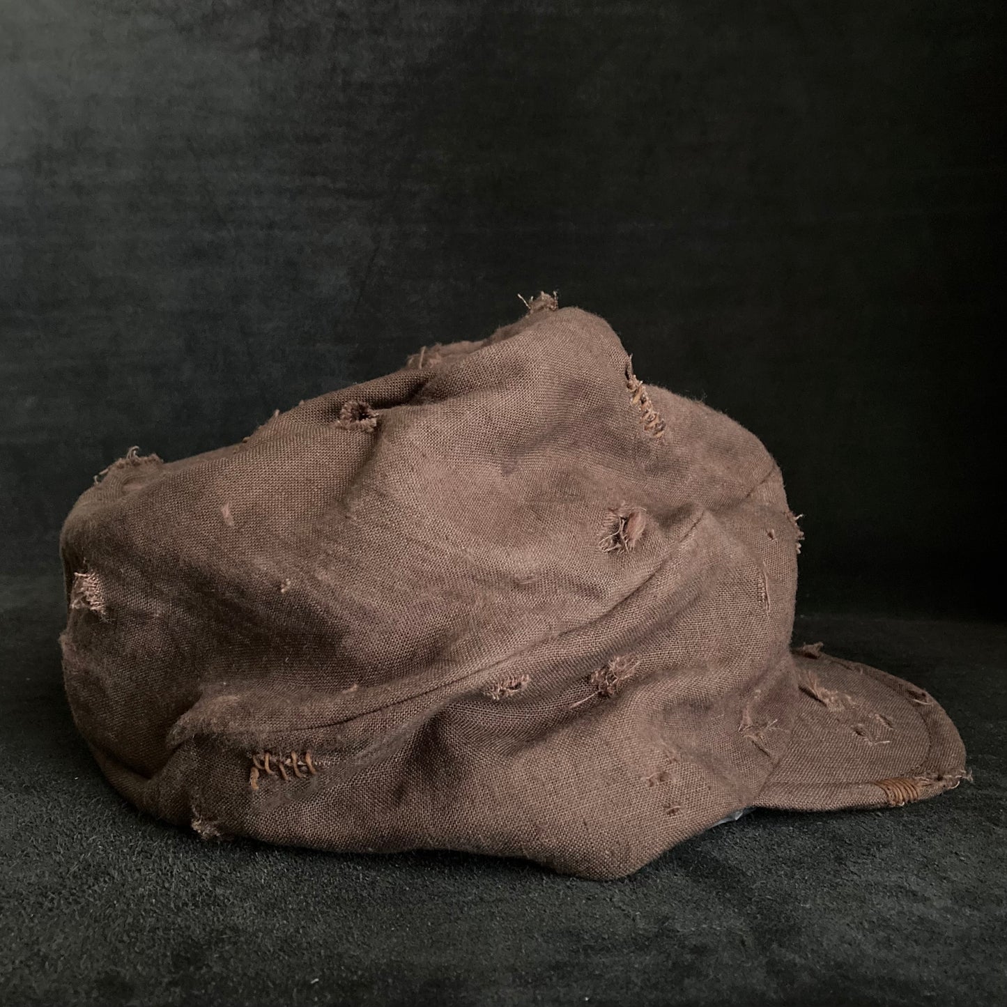 Brown linen damage turn cap (brim core)