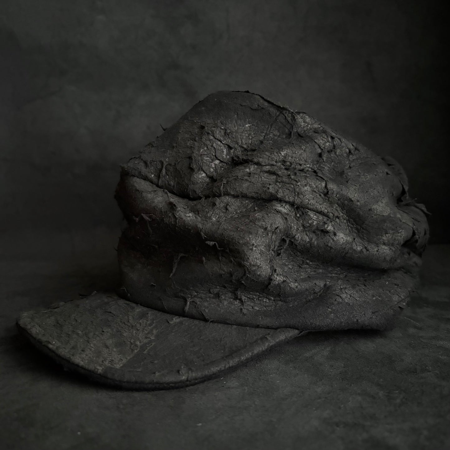 Floor under black leather turn cap (brim core)
