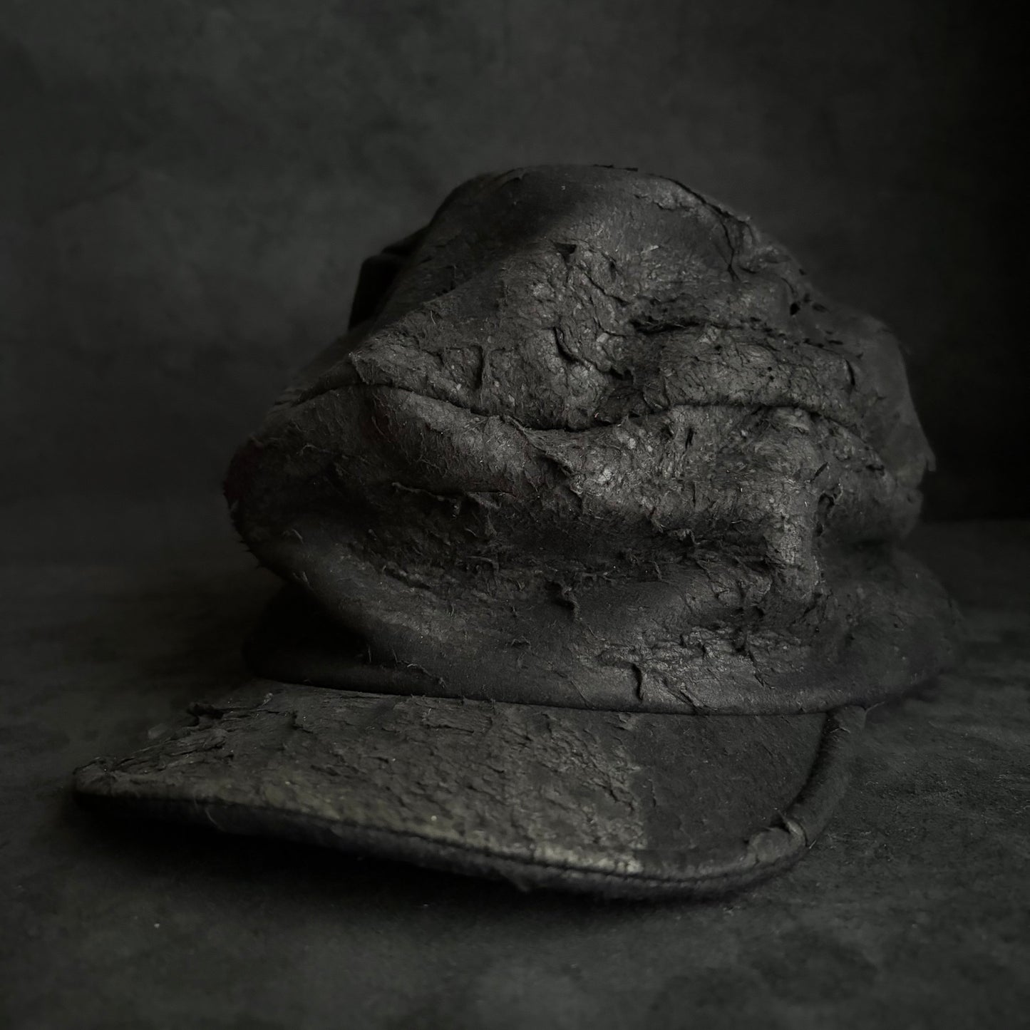 Floor under black leather turn cap (brim core)