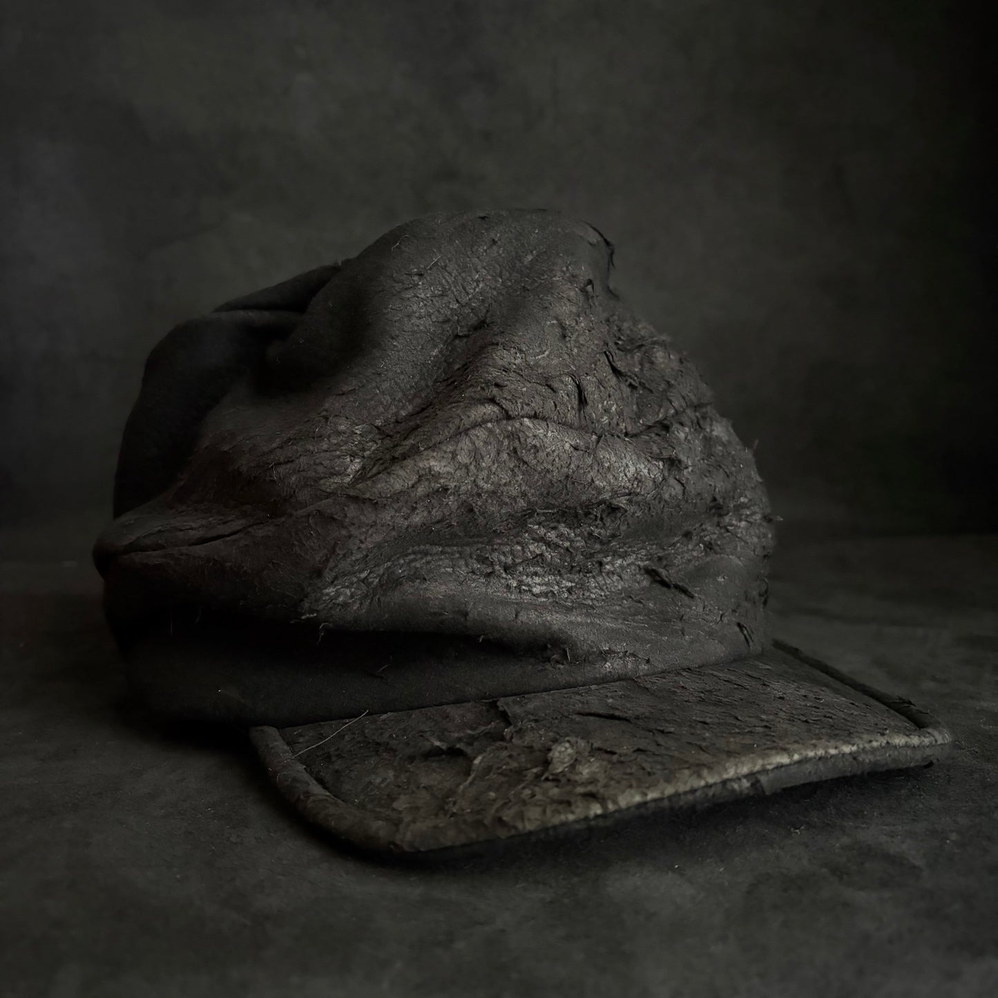 Floor under black leather turn cap (brim core)