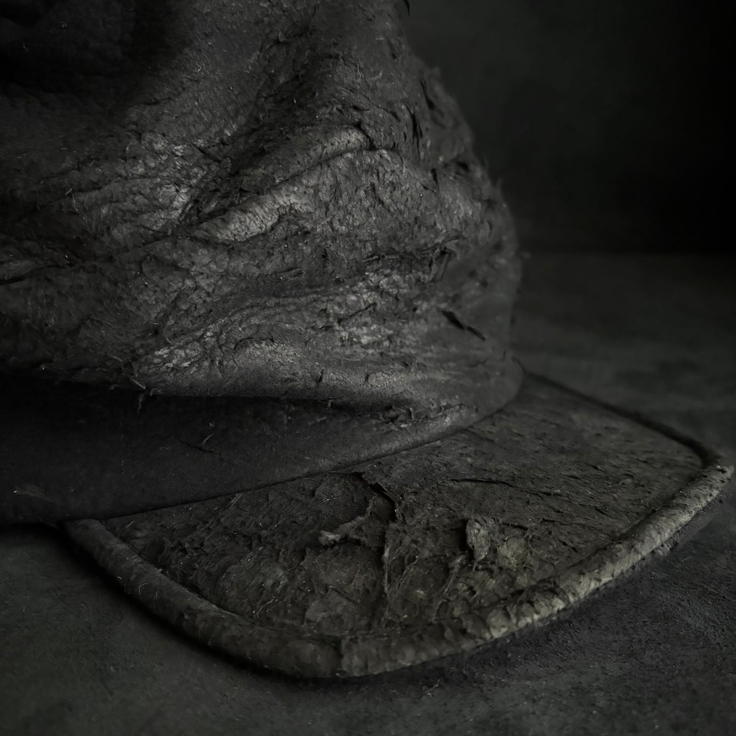 Floor under black leather turn cap (brim core)