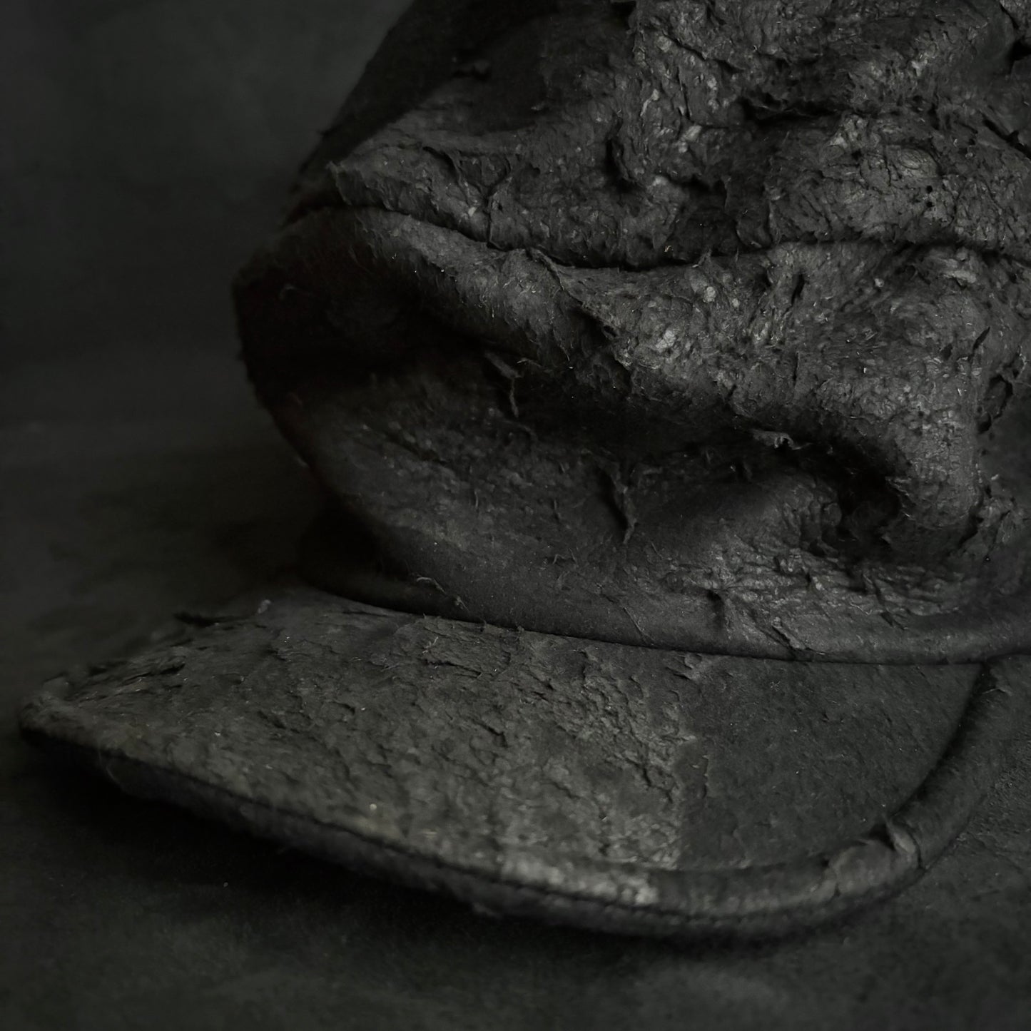 Floor under black leather turn cap (brim core)