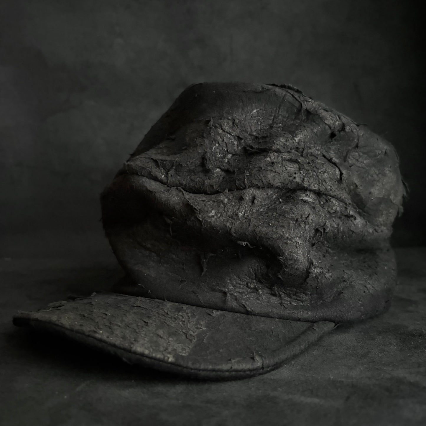 Floor under black leather turn cap (brim core)