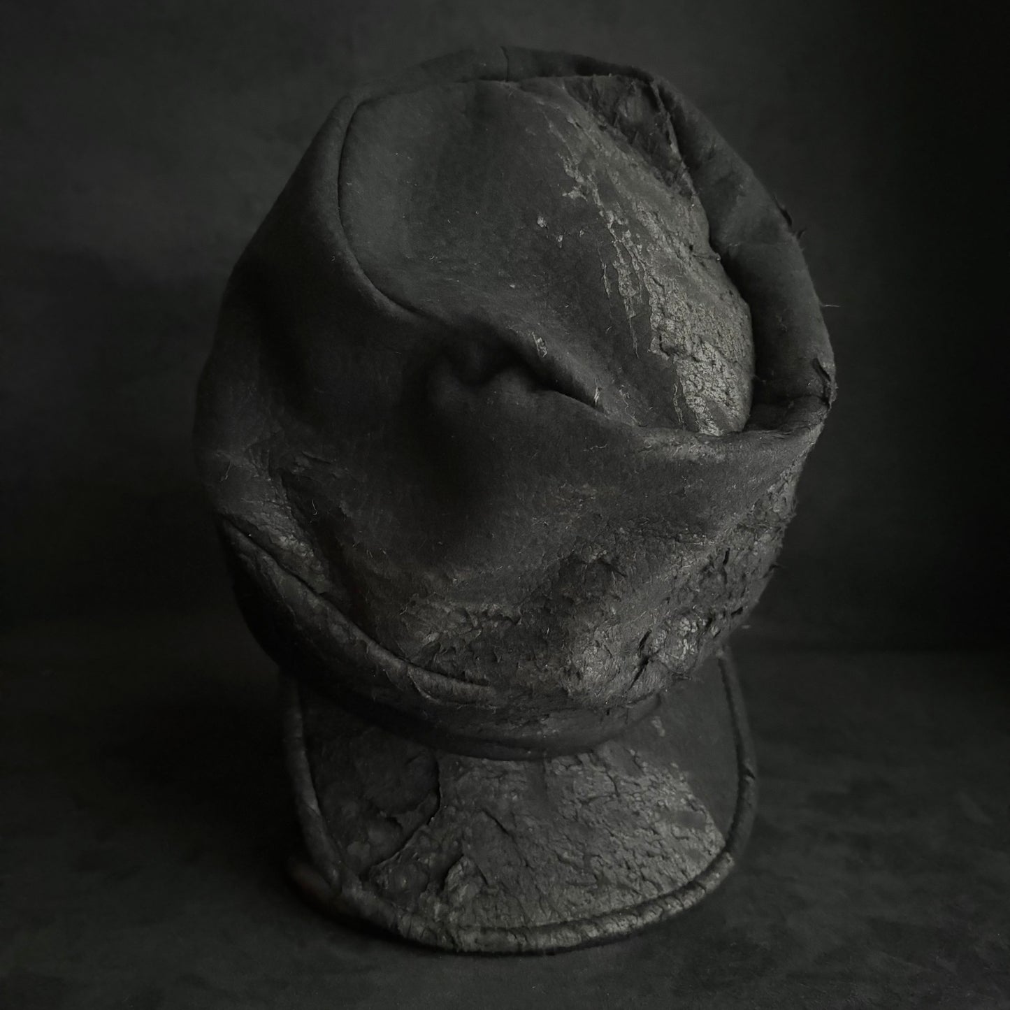 Floor under black leather turn cap (brim core)