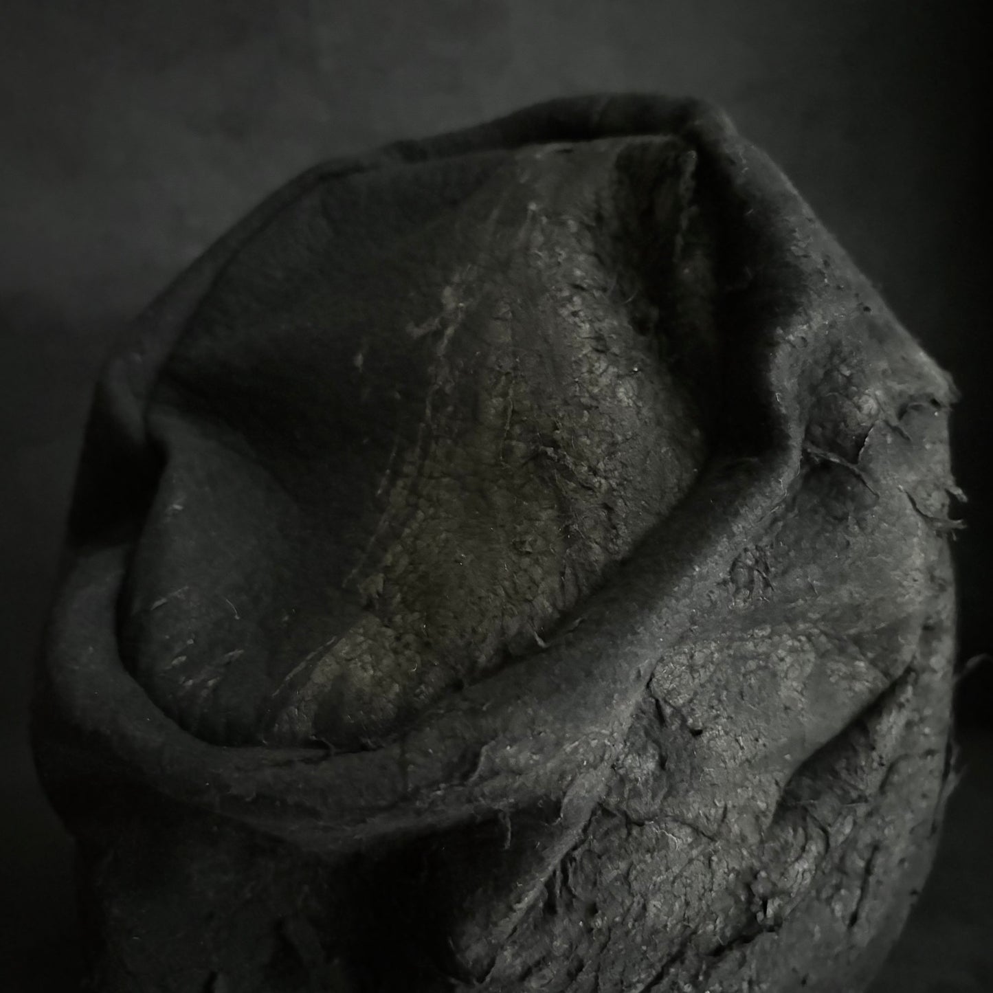Floor under black leather turn cap (brim core)